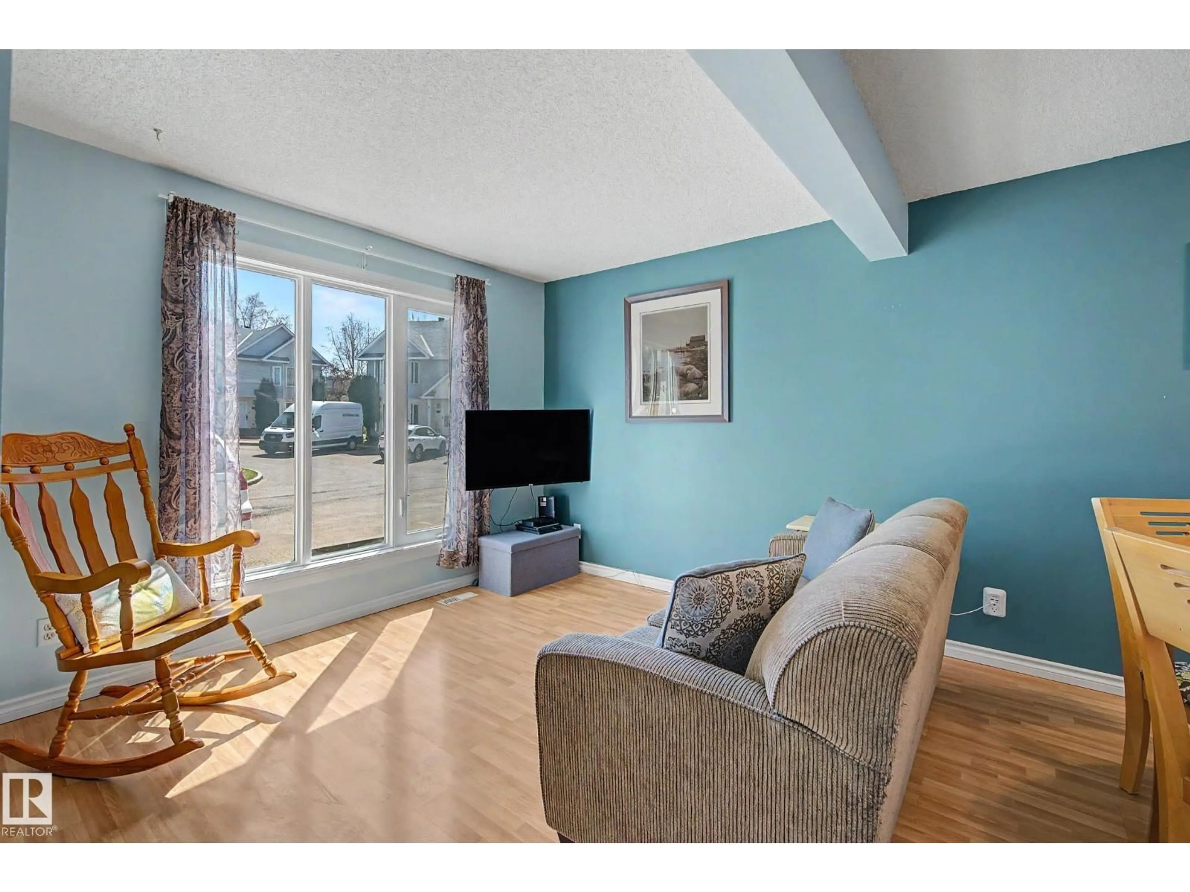 Living room with furniture, wood/laminate floor for 5 - 129 ABERDEEN WY, Stony Plain Alberta T7Z1N1