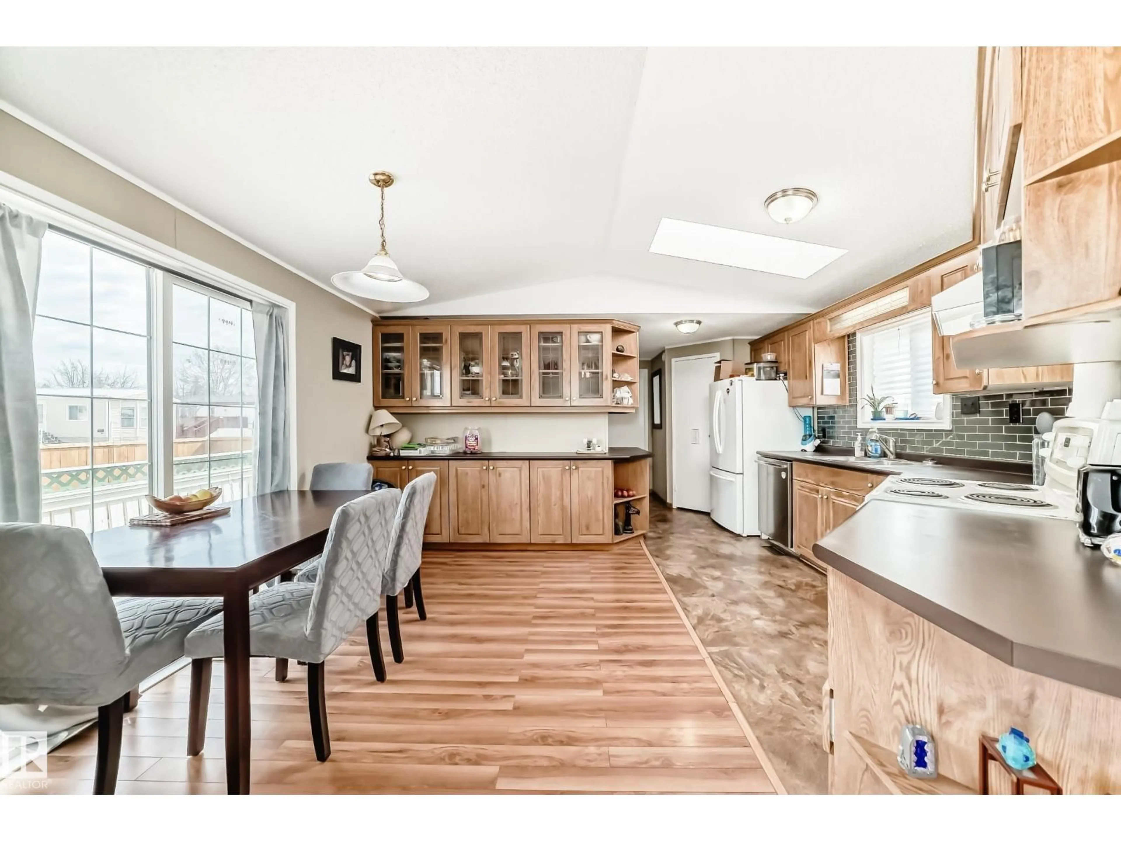 Open concept kitchen, wood/laminate floor for 2903 LAKEWOOD DRIVE, Edmonton Alberta T5S1T7