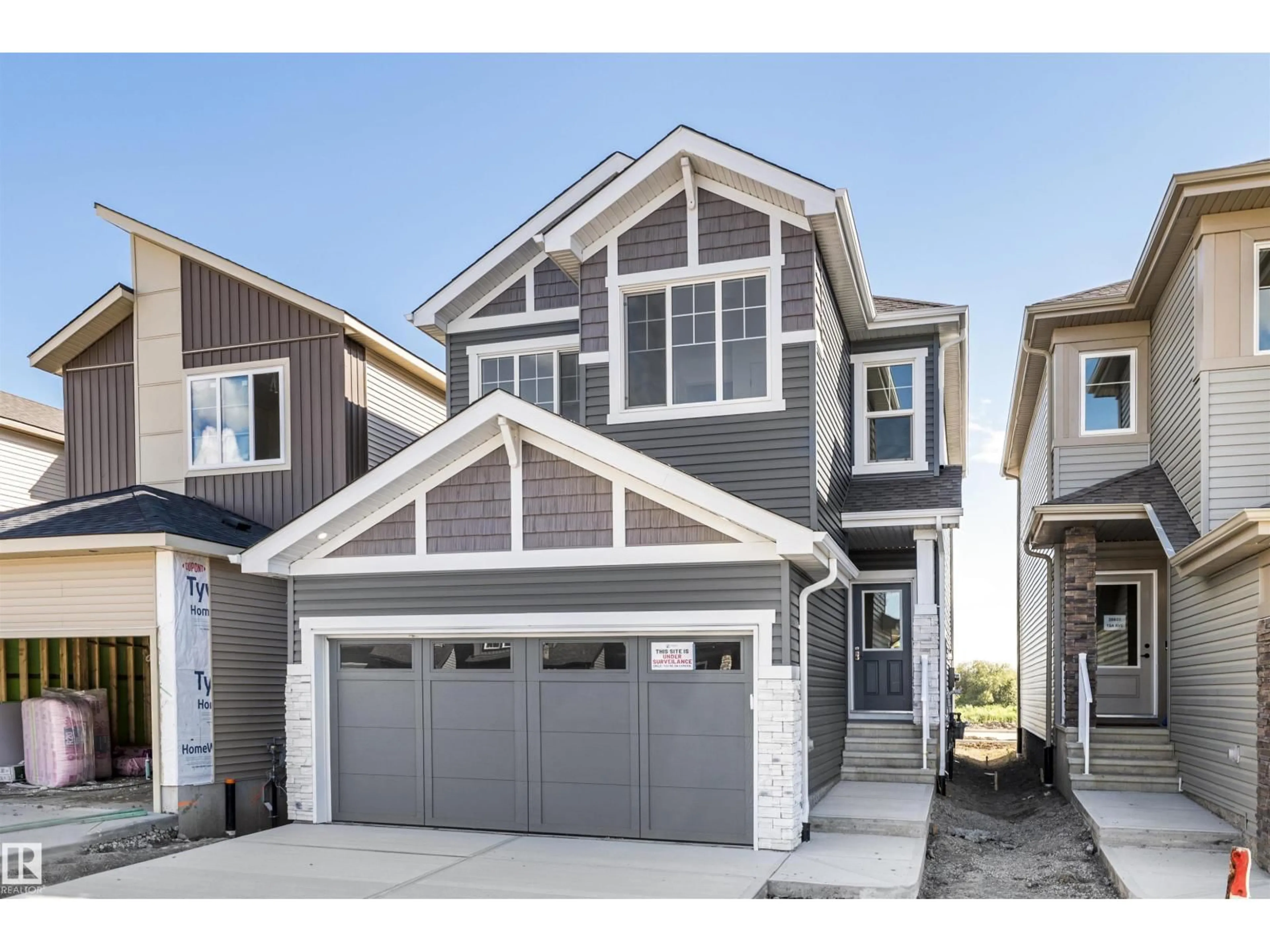 Home with vinyl exterior material, street for 20829 15A AV AV, Edmonton Alberta T6M3N8