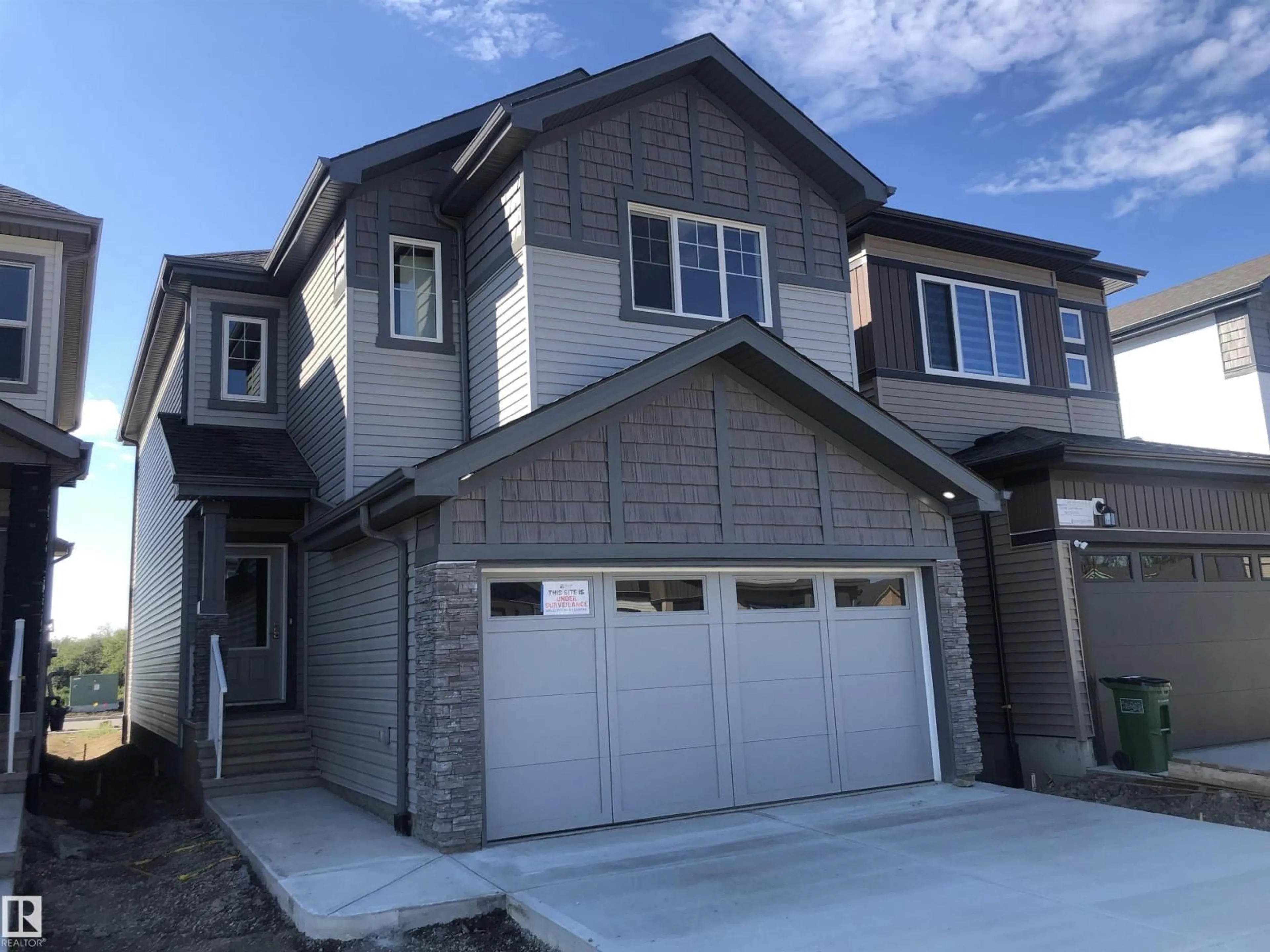 Home with vinyl exterior material, street for 20841 15A AV, Edmonton Alberta T6M3H7