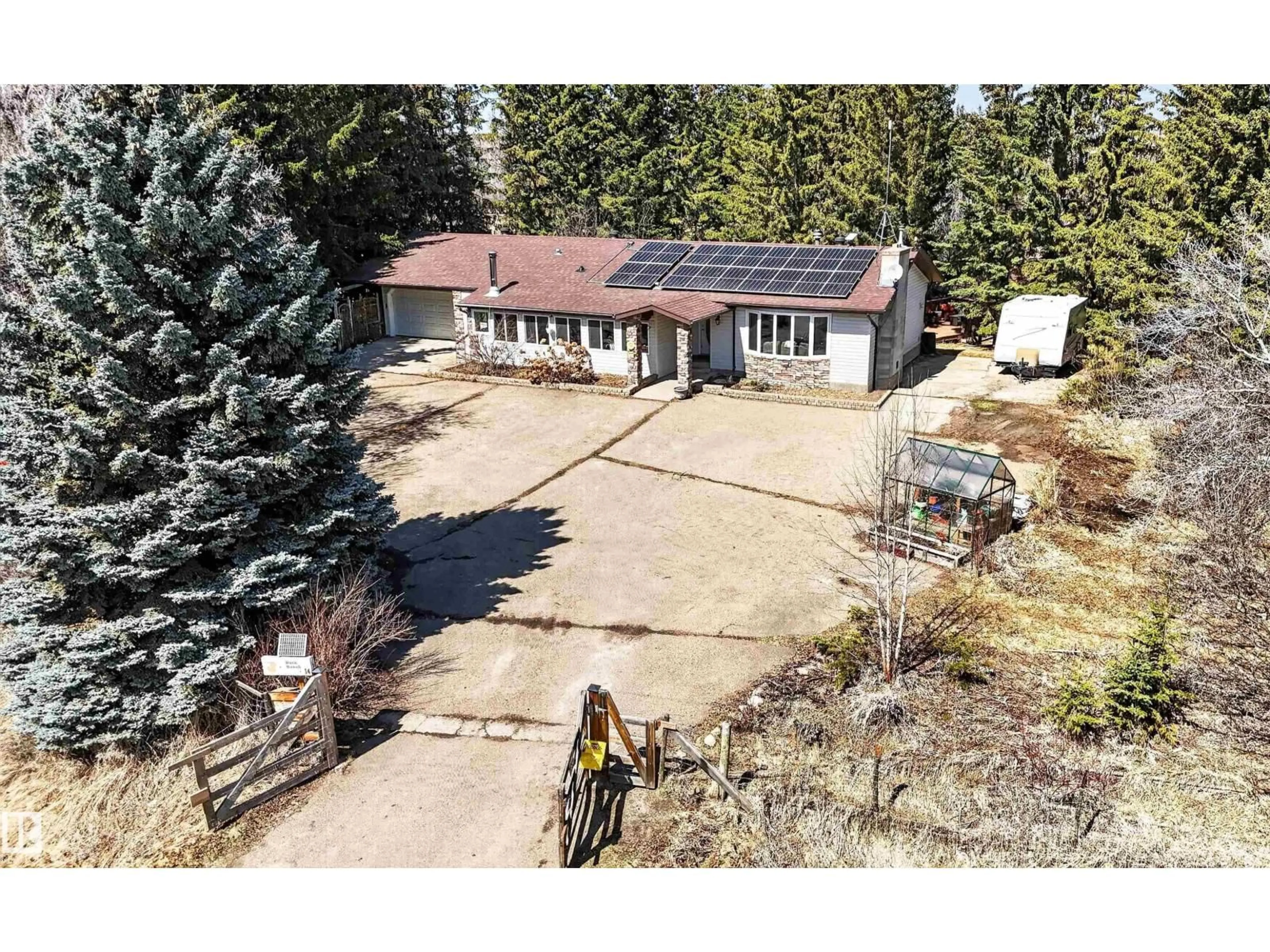 A pic from outside/outdoor area/front of a property/back of a property/a pic from drone, street for 14 - 53227 RGE ROAD 14, Rural Parkland County Alberta T7Y0G3