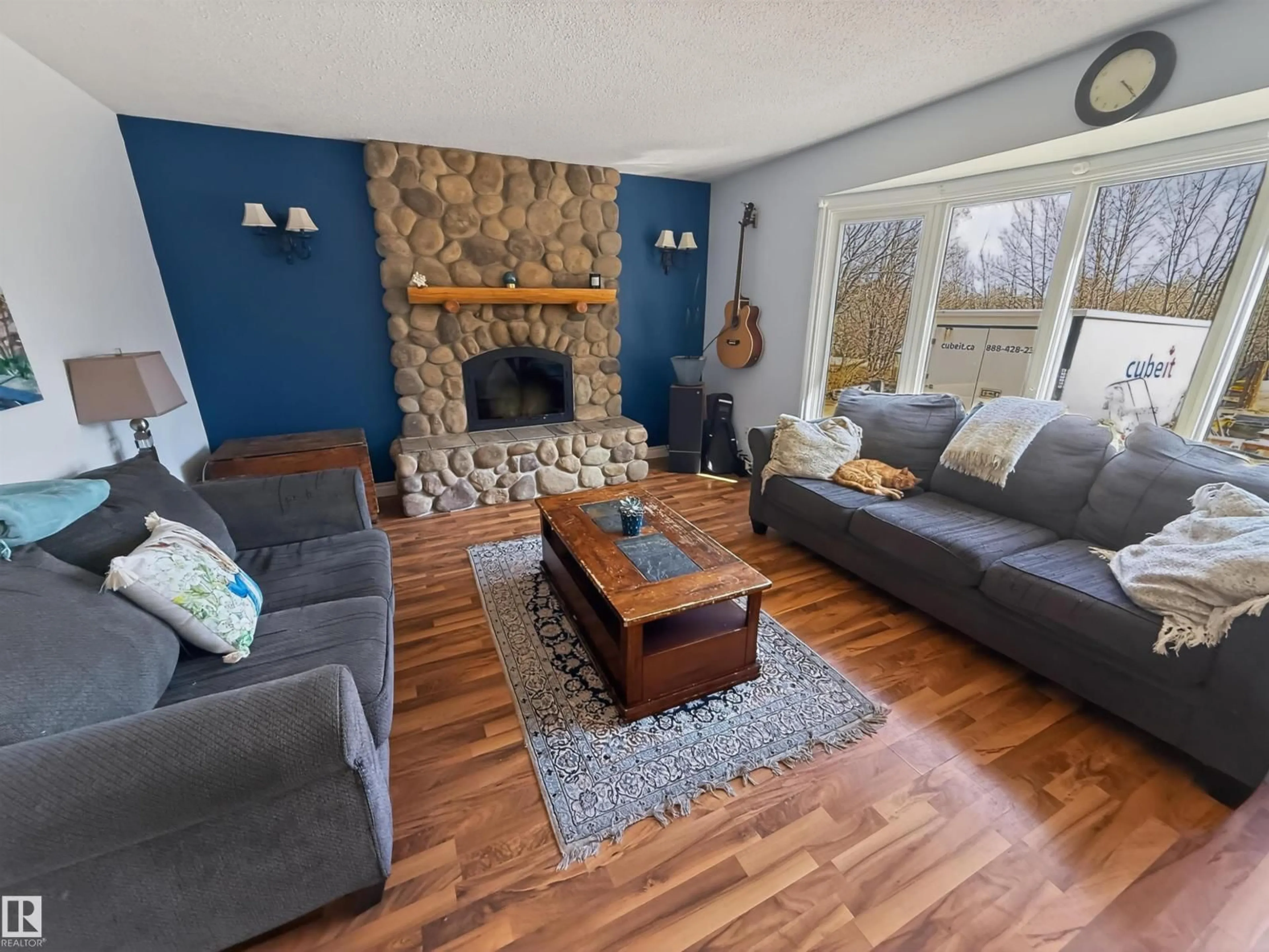 Living room with furniture, wood/laminate floor for 14 - 53227 RGE ROAD 14, Rural Parkland County Alberta T7Y0G3