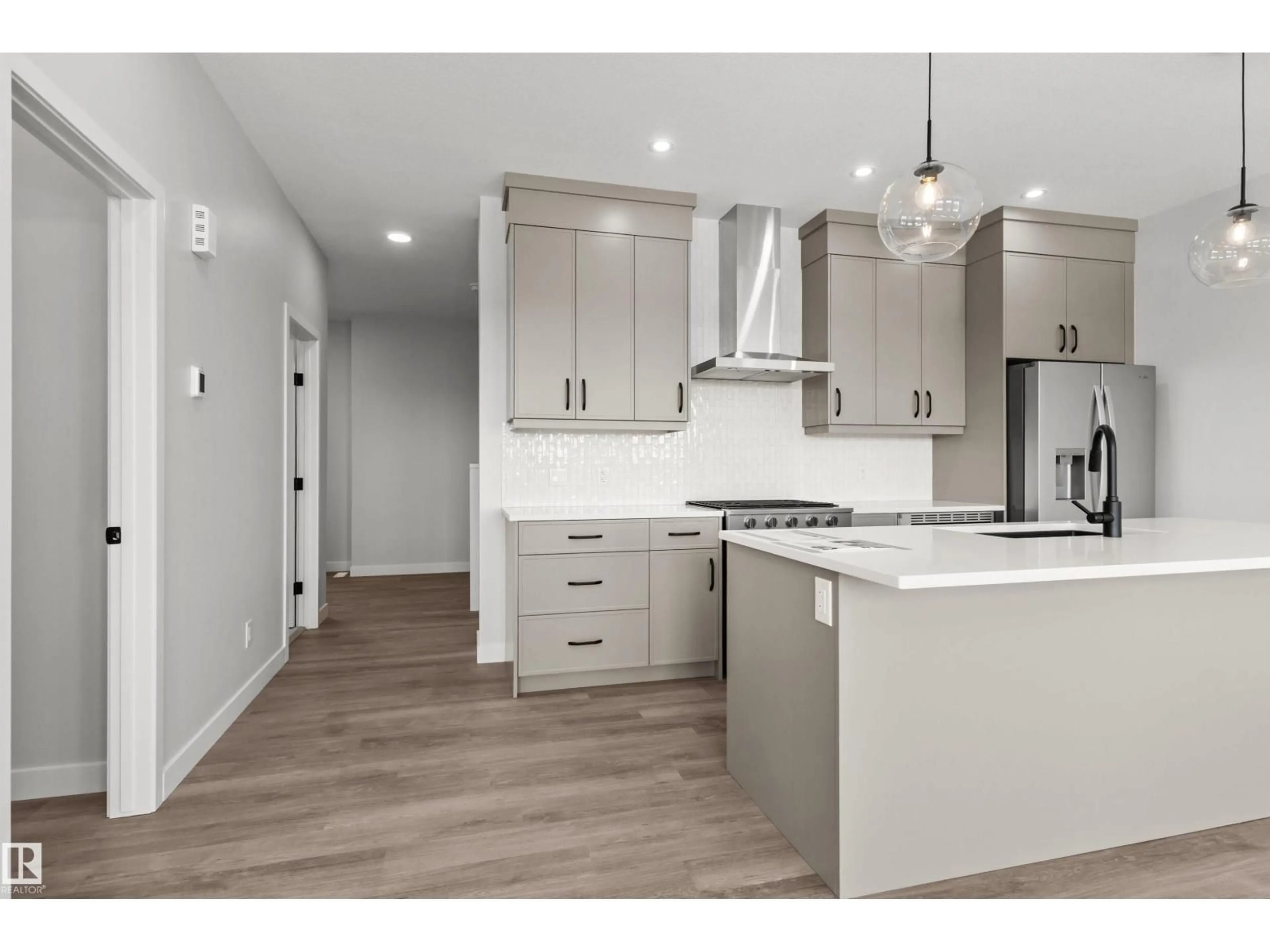 Open concept kitchen, wood/laminate floor for 287 PATERSON LINK LI SW, Edmonton Alberta T6W5V2