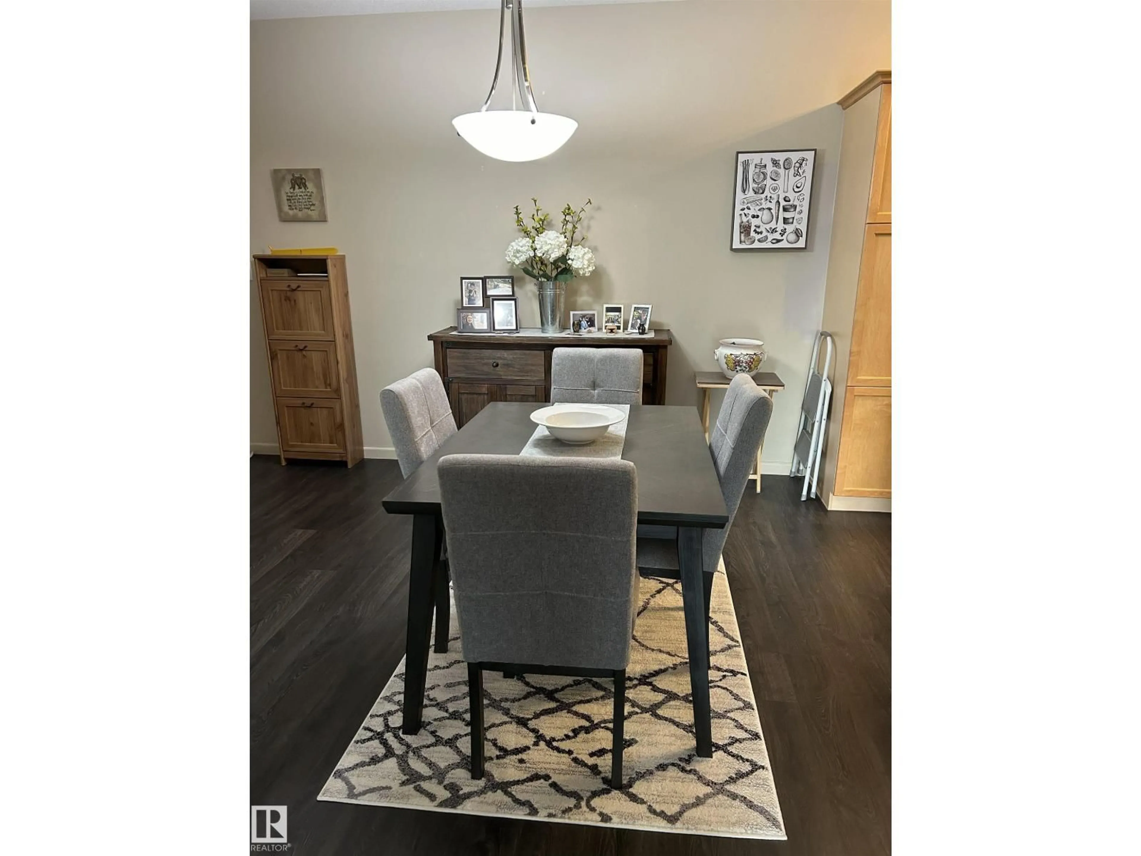 Dining room, wood/laminate floor for #226 - 2503 HANNA CR, Edmonton Alberta T6R0H1