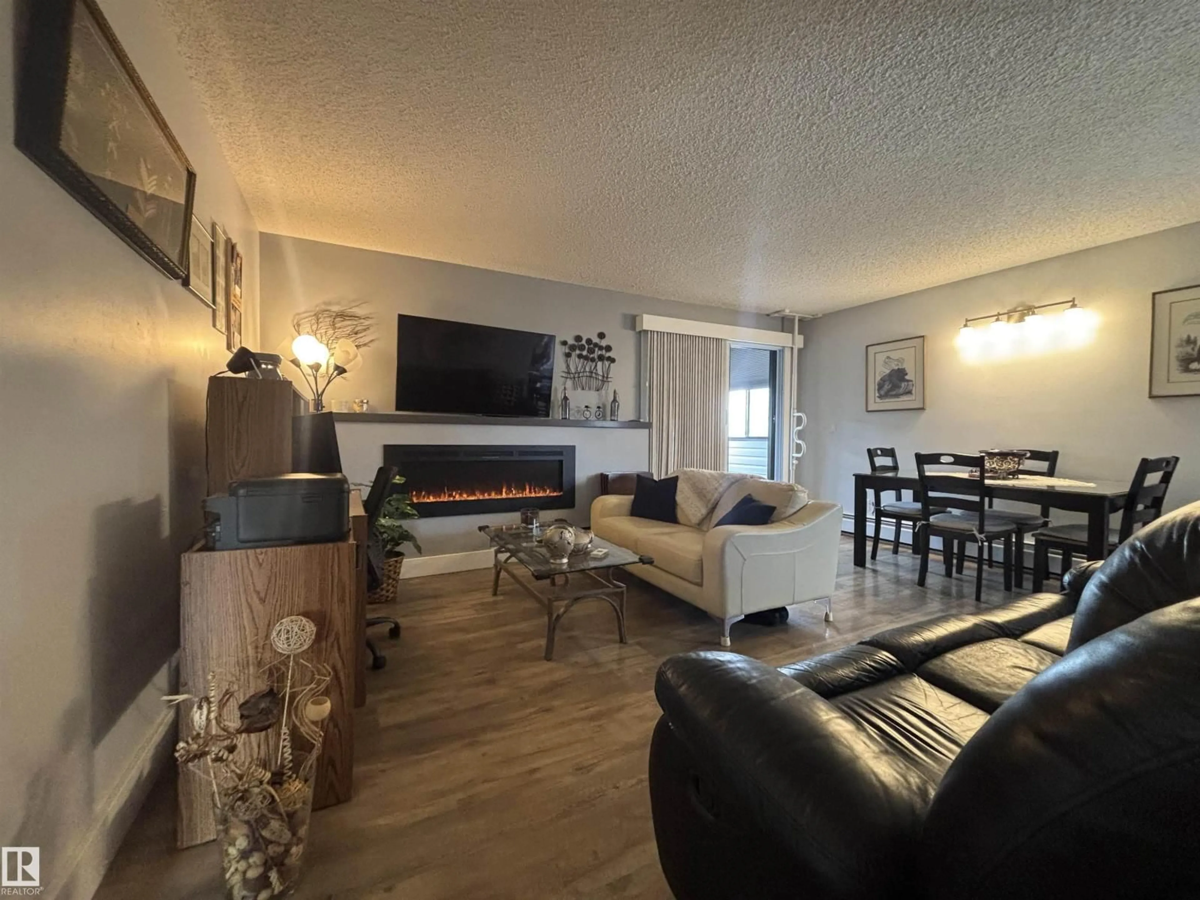 Living room with furniture, wood/laminate floor for 320 JUBILEE DR, Fort Saskatchewan Alberta T8L2M1