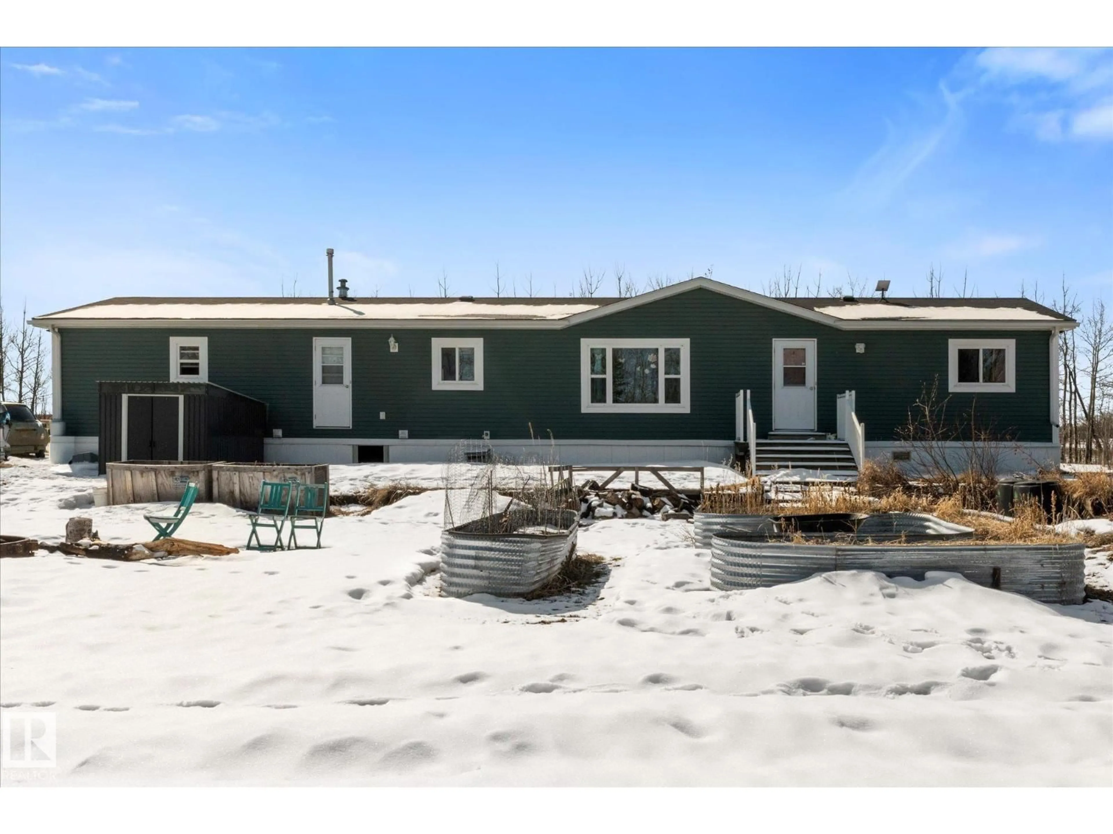 Home with vinyl exterior material, street for 56217 RGE ROAD 30, Rural Lac Ste. Anne County Alberta T0E0A1