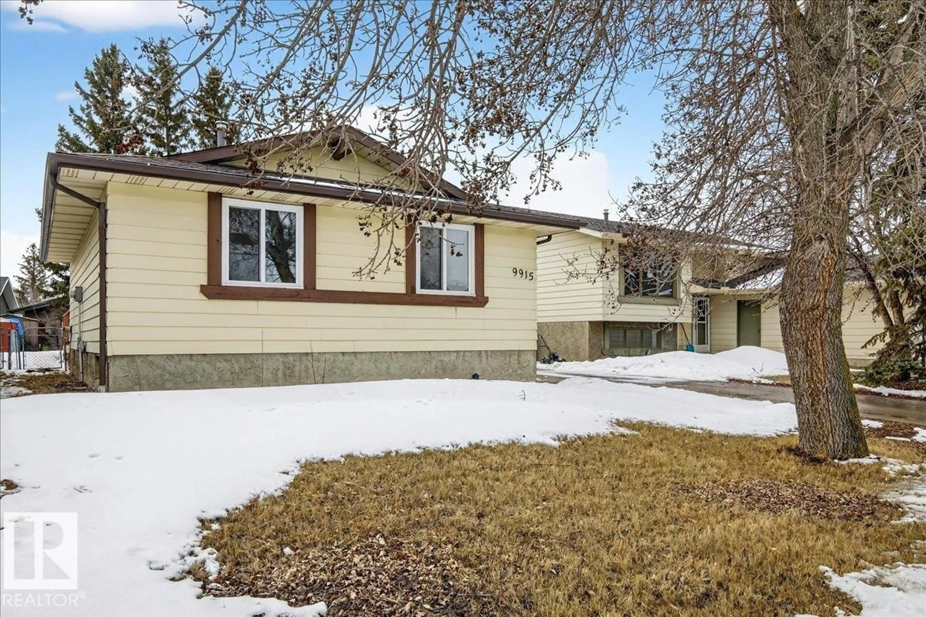 Home with vinyl exterior material, street for 9915 173 AV, Edmonton Alberta T5X3Y1