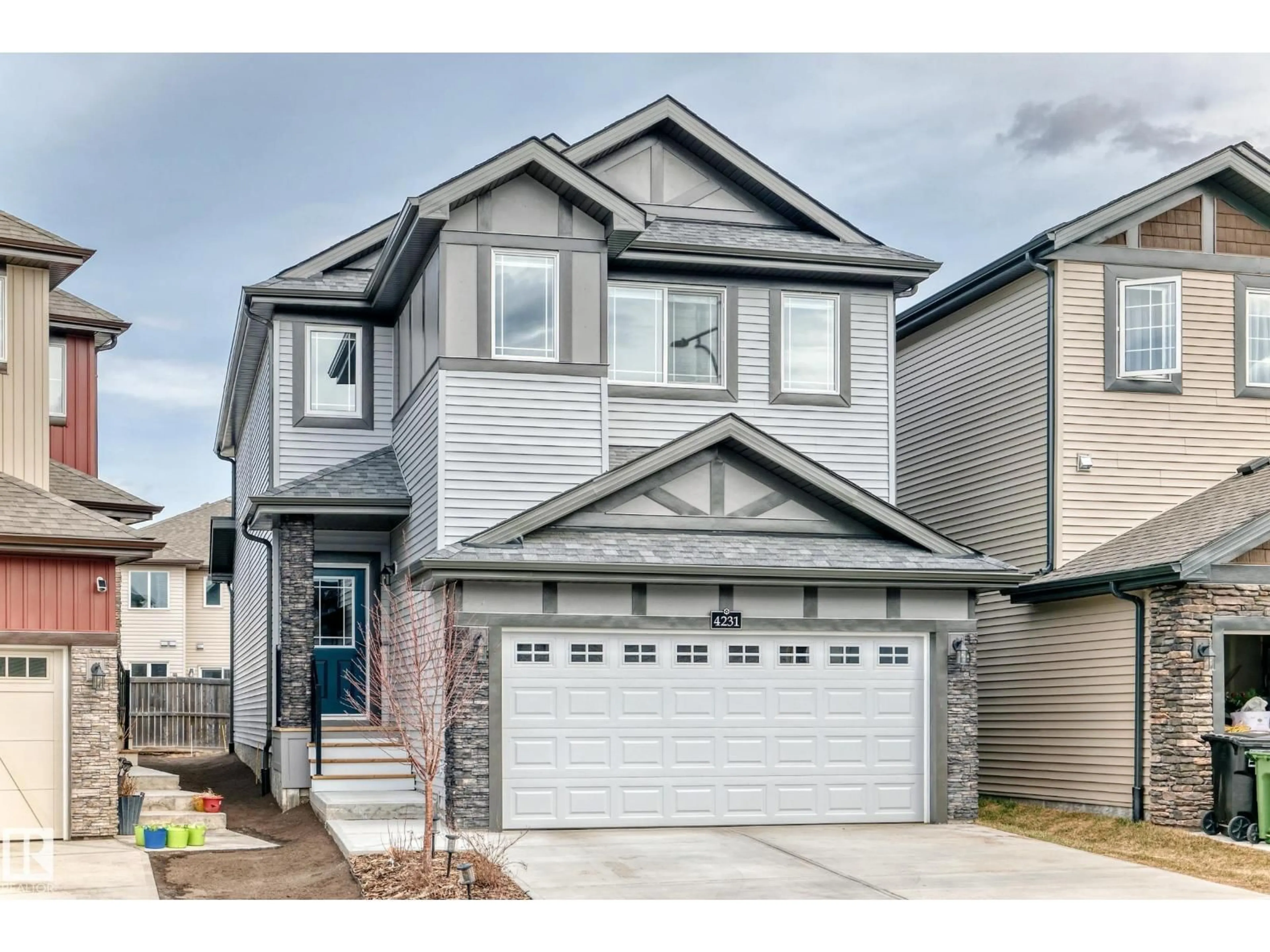 Home with vinyl exterior material, street for NW - 4231 206 ST, Edmonton Alberta T6M3E3