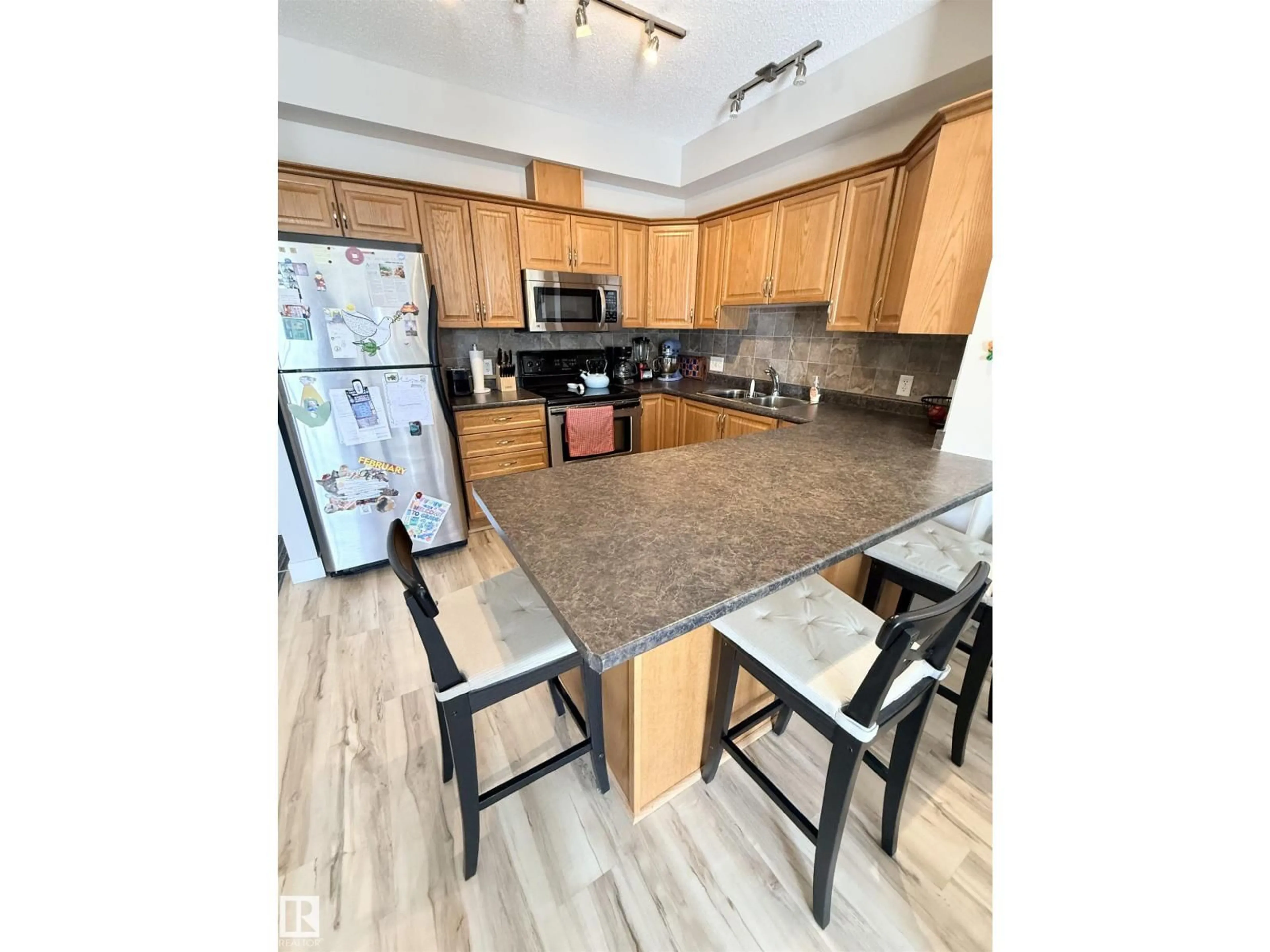 Open concept kitchen, unknown for #309 - 8931 156 ST, Edmonton Alberta T5R1Y6