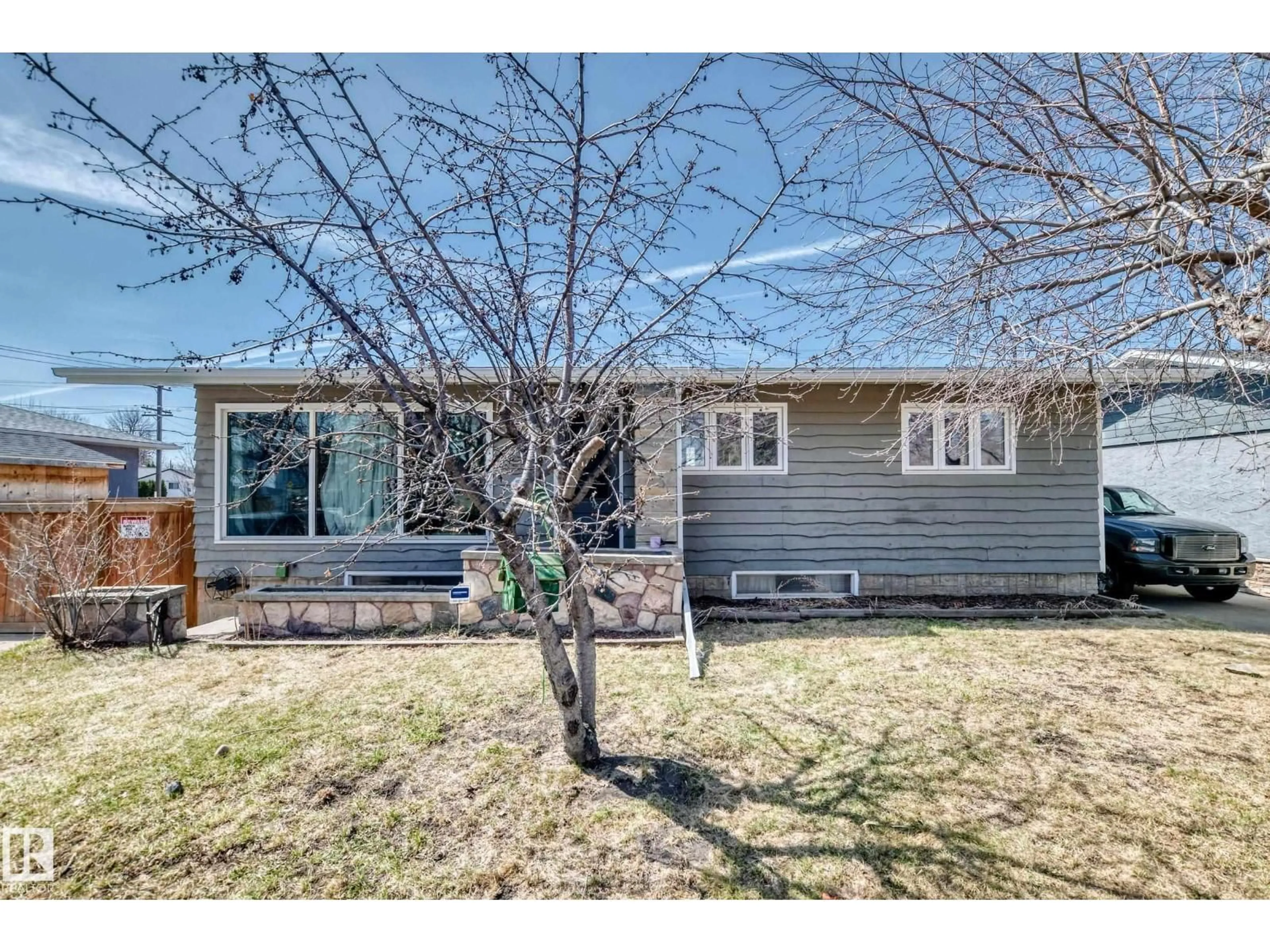 Home with vinyl exterior material, street for NW - 12106 48 ST, Edmonton Alberta T5W2Z2