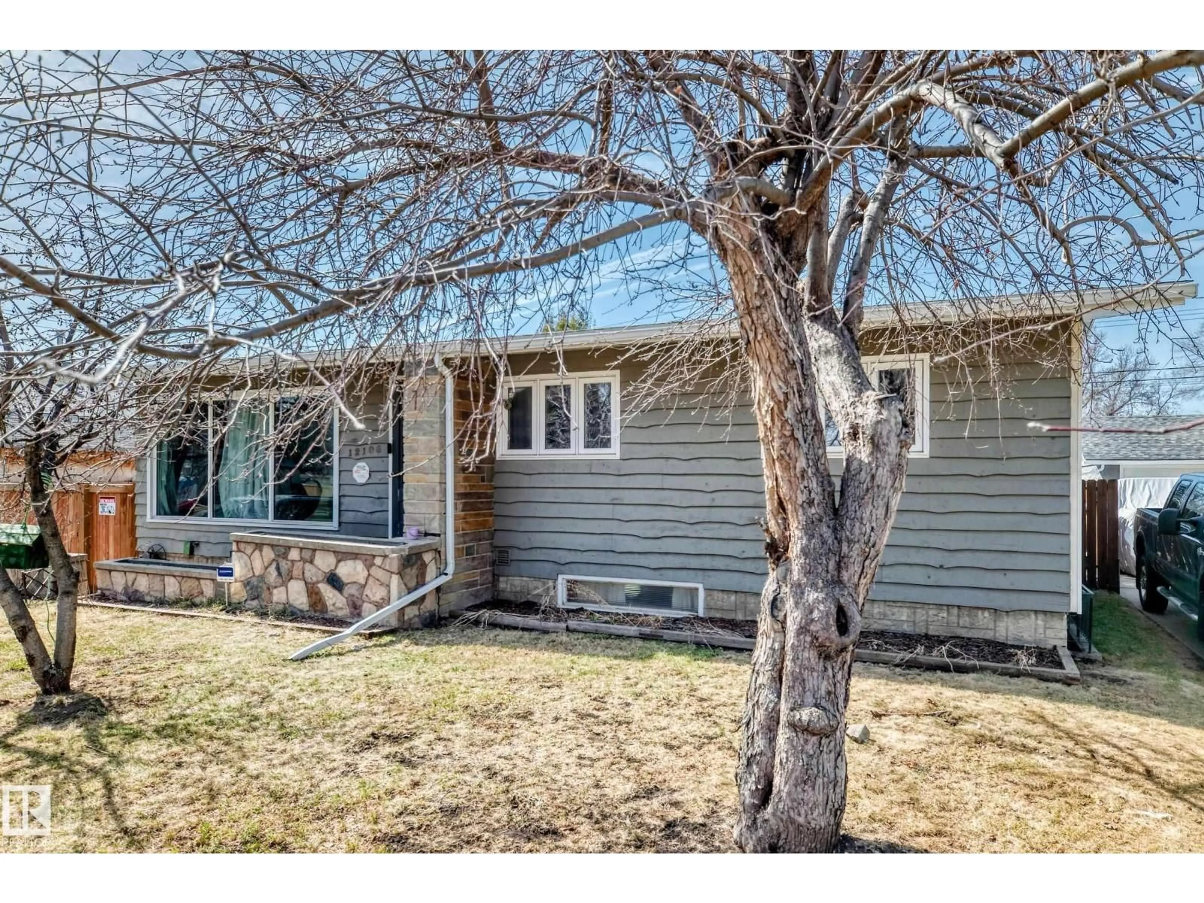 Home with vinyl exterior material, street for NW - 12106 48 ST, Edmonton Alberta T5W2Z2