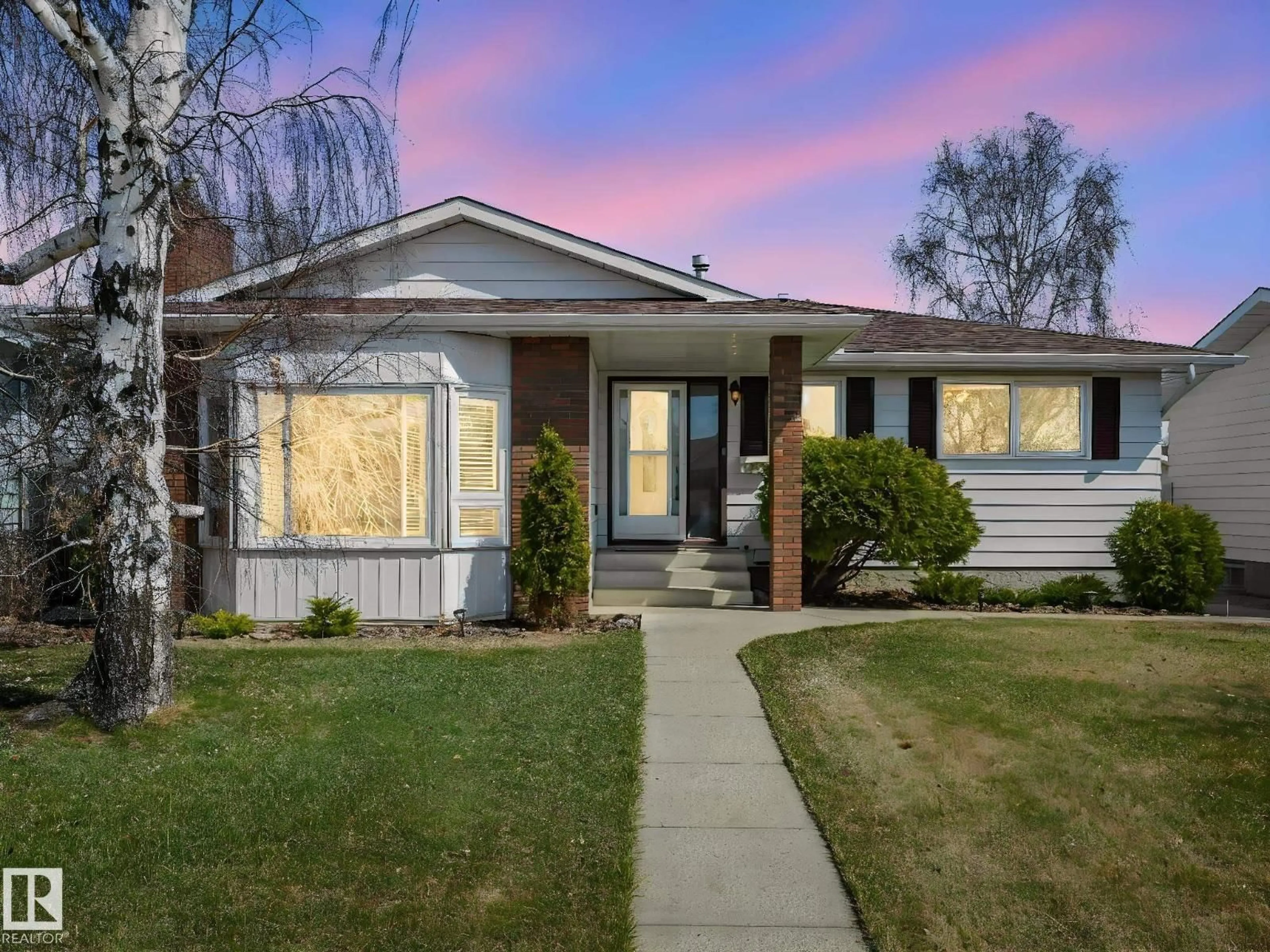 Home with vinyl exterior material, street for 1027 77 ST, Edmonton Alberta T6K3G4