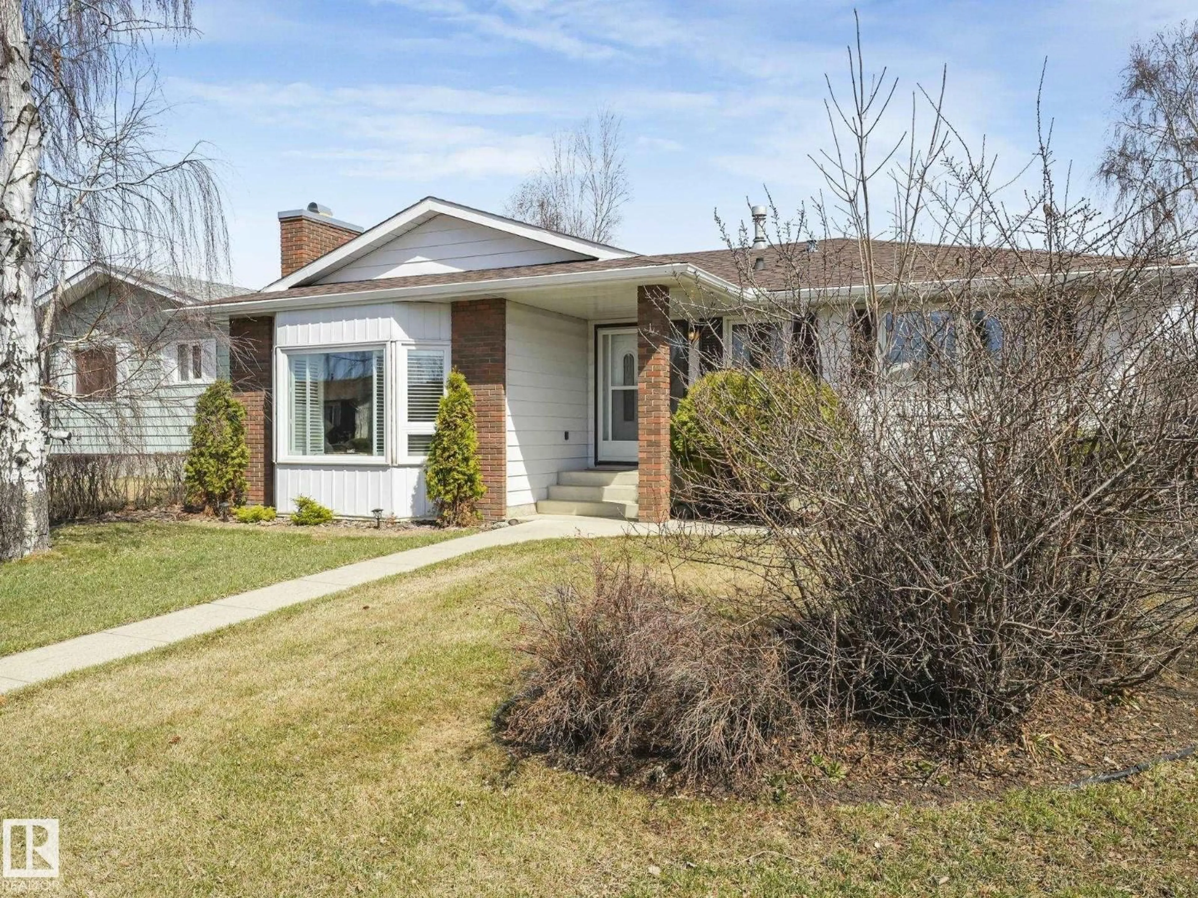 Home with brick exterior material, street for 1027 77 ST, Edmonton Alberta T6K3G4