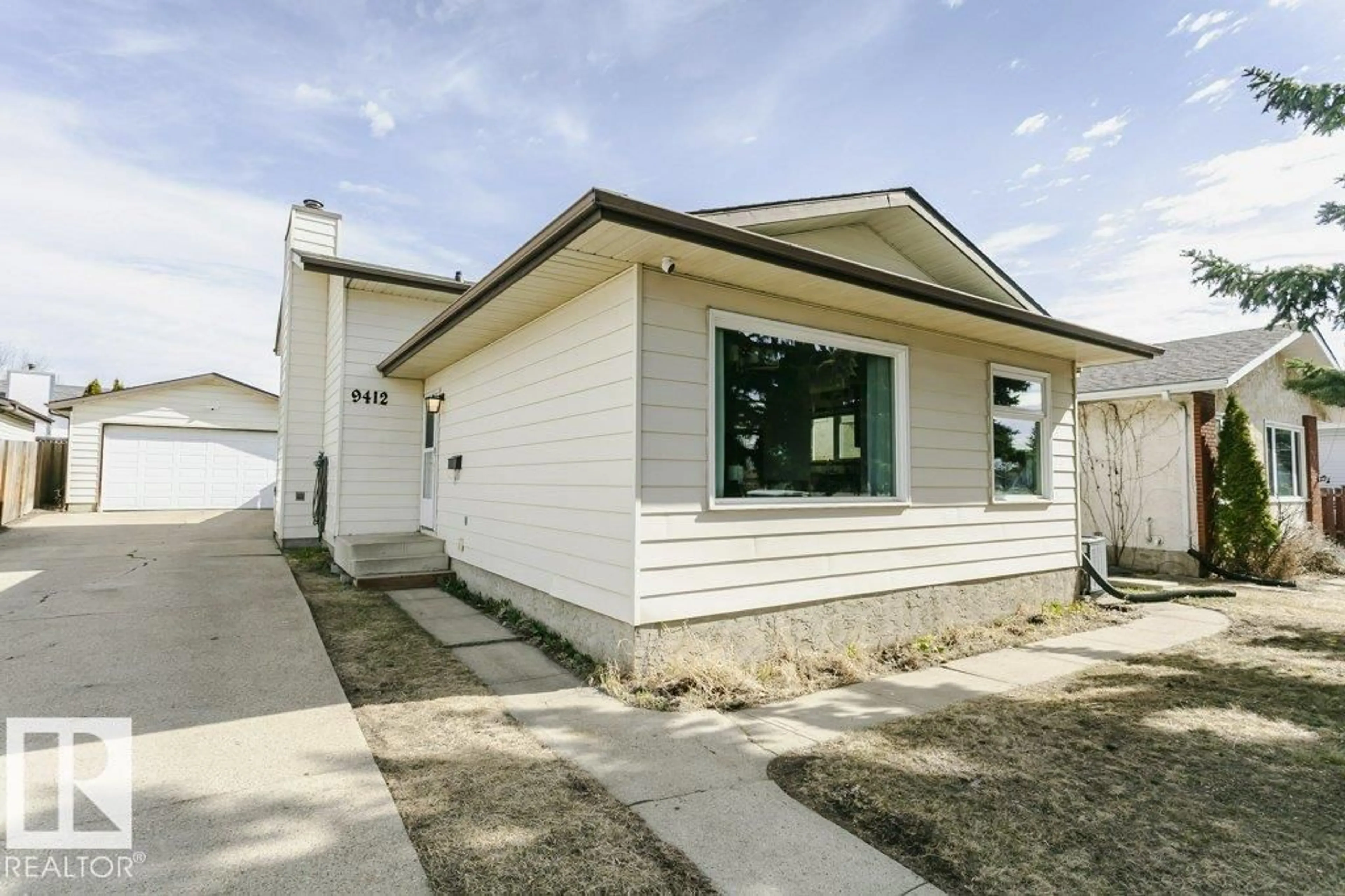 Home with vinyl exterior material, street for NW - 9412 176 AV, Edmonton Alberta T5Z2C1