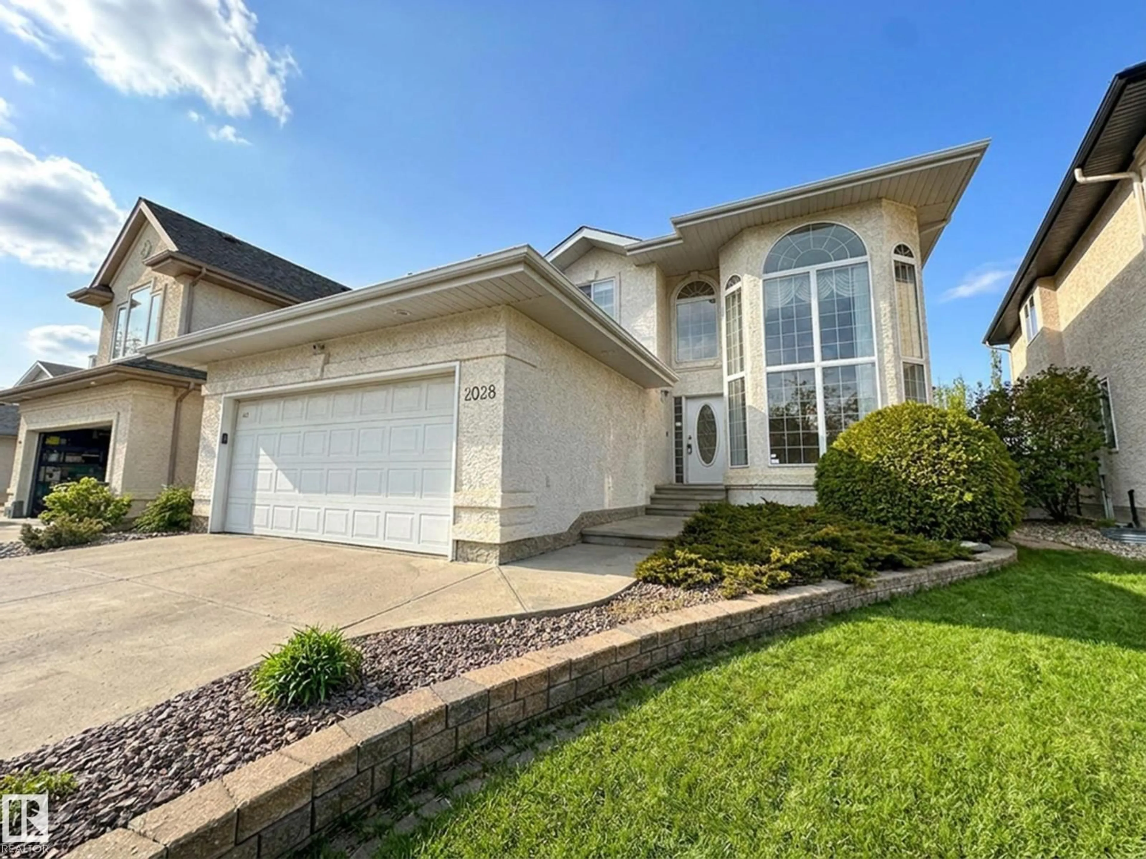 Home with vinyl exterior material, street for 2028 HADDOW DR, Edmonton Alberta T6R2W2