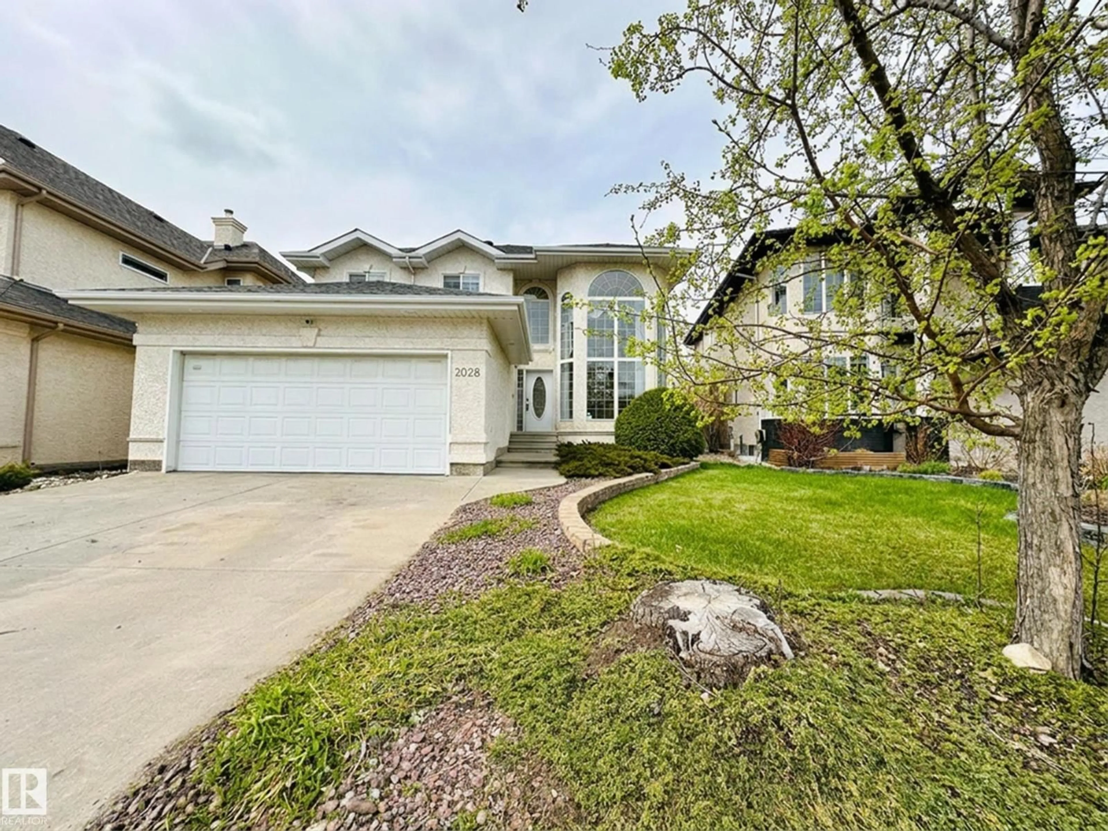 Home with vinyl exterior material, street for 2028 HADDOW DR, Edmonton Alberta T6R2W2