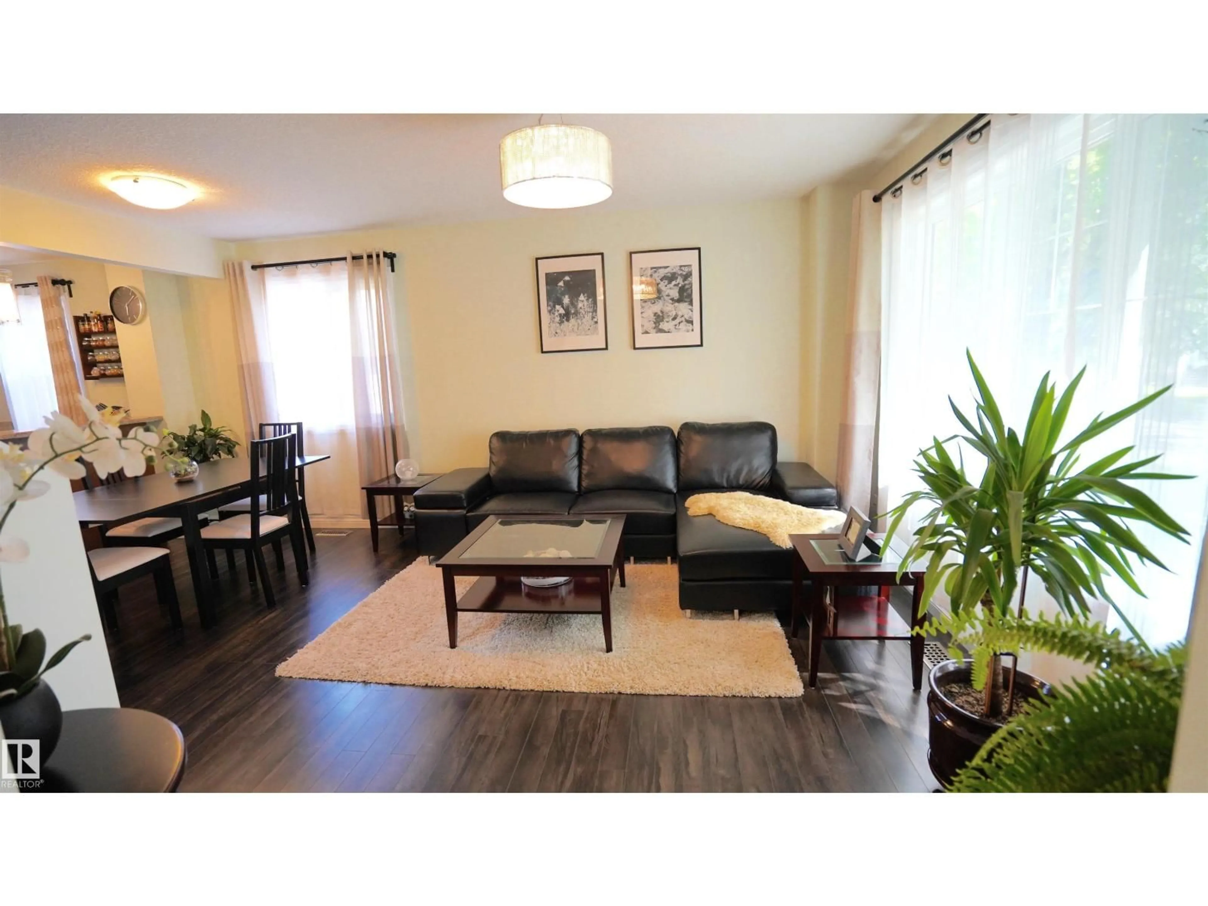 Living room with furniture, wood/laminate floor for NW - 12018 65 ST, Edmonton Alberta T5W4L7