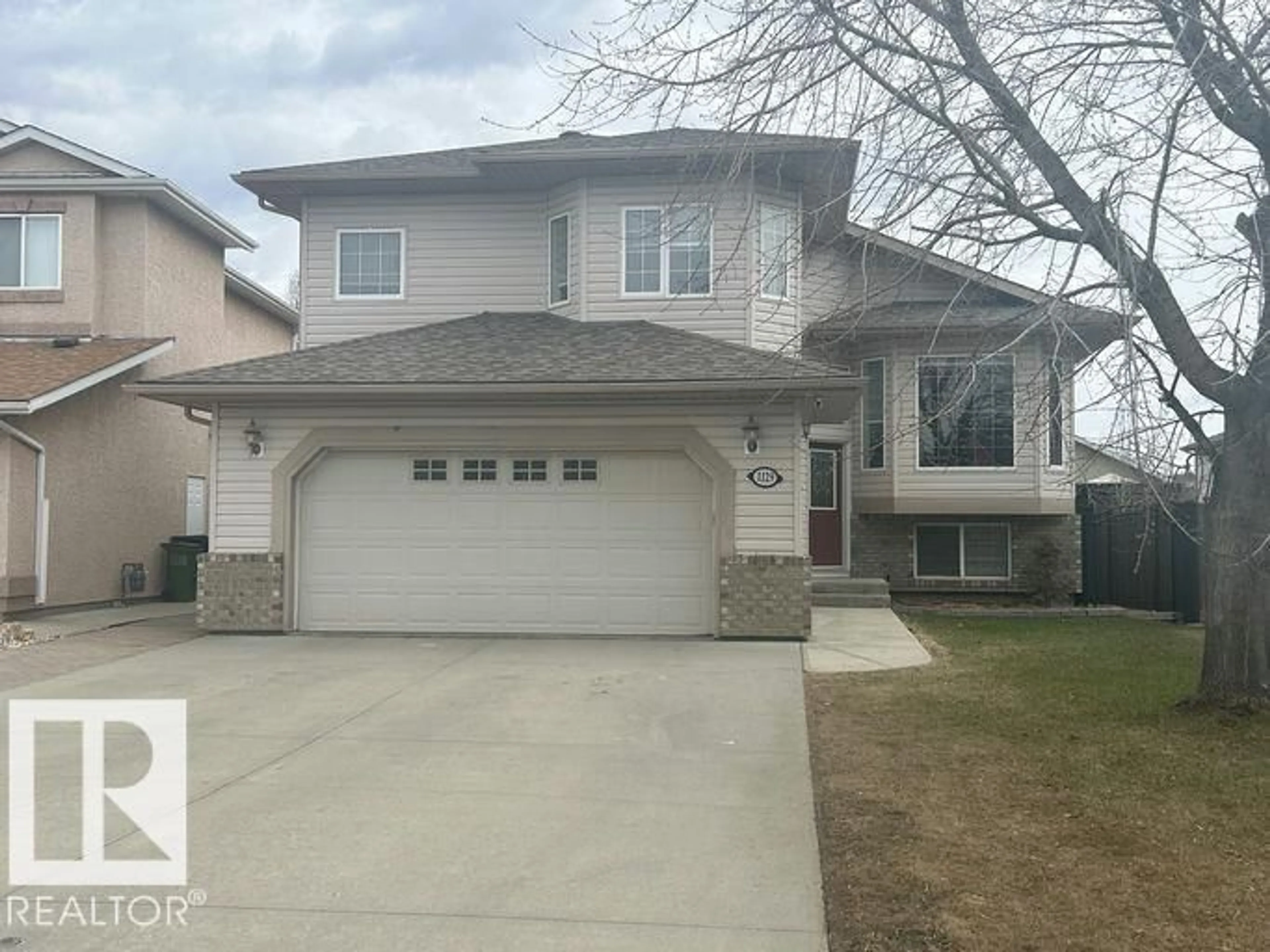 Home with vinyl exterior material, street for 1129 KLARVATTEN COVE CV, Edmonton Alberta T5Z3N3