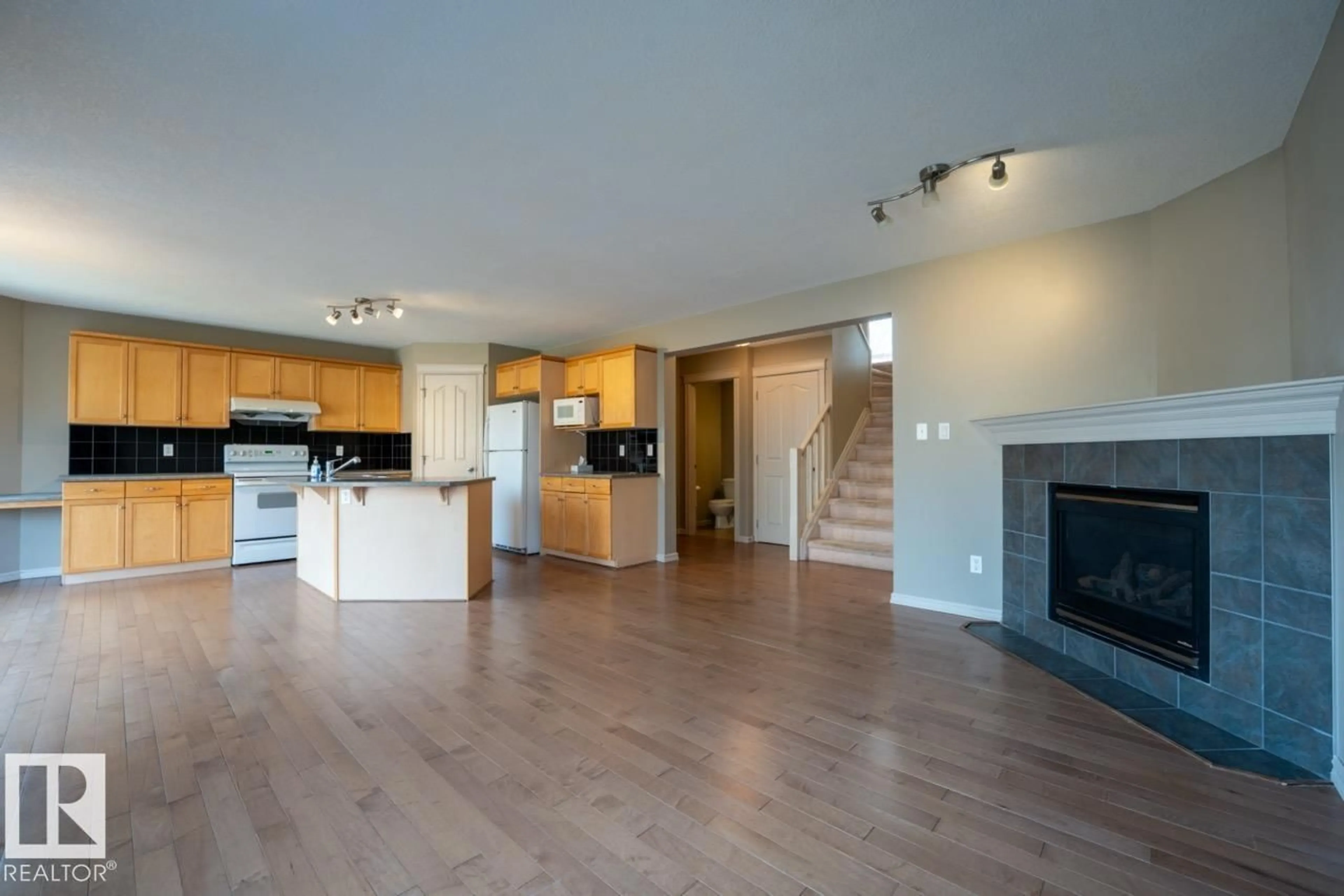 Open concept kitchen, wood/laminate floor for 1431 HODGSON WAY, Edmonton Alberta T6R3N5