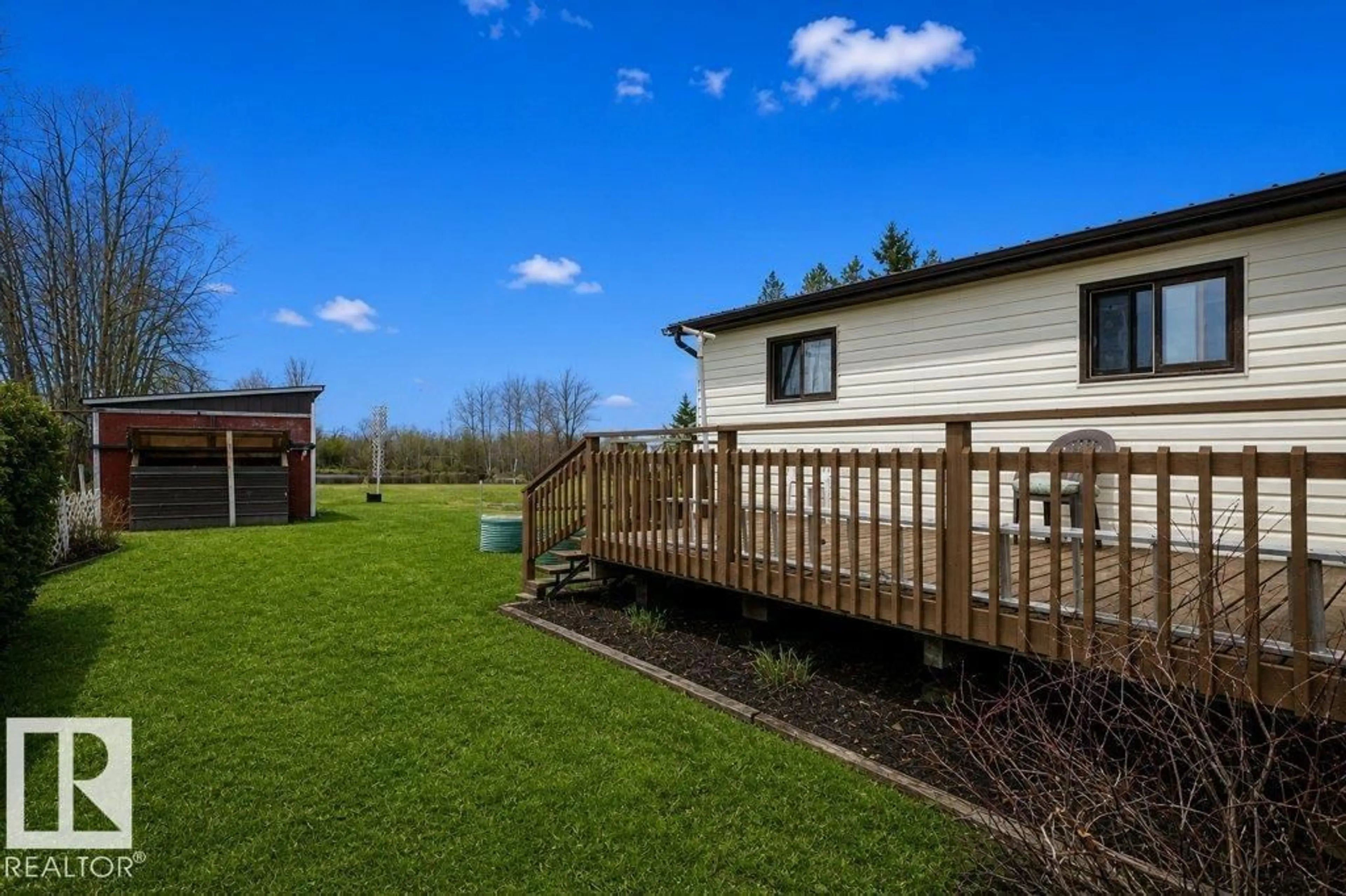 A pic from outside/outdoor area/front of a property/back of a property/a pic from drone, water/lake/river/ocean view for 25517 TWP RD 594, Rural Westlock County Alberta T7P2N6