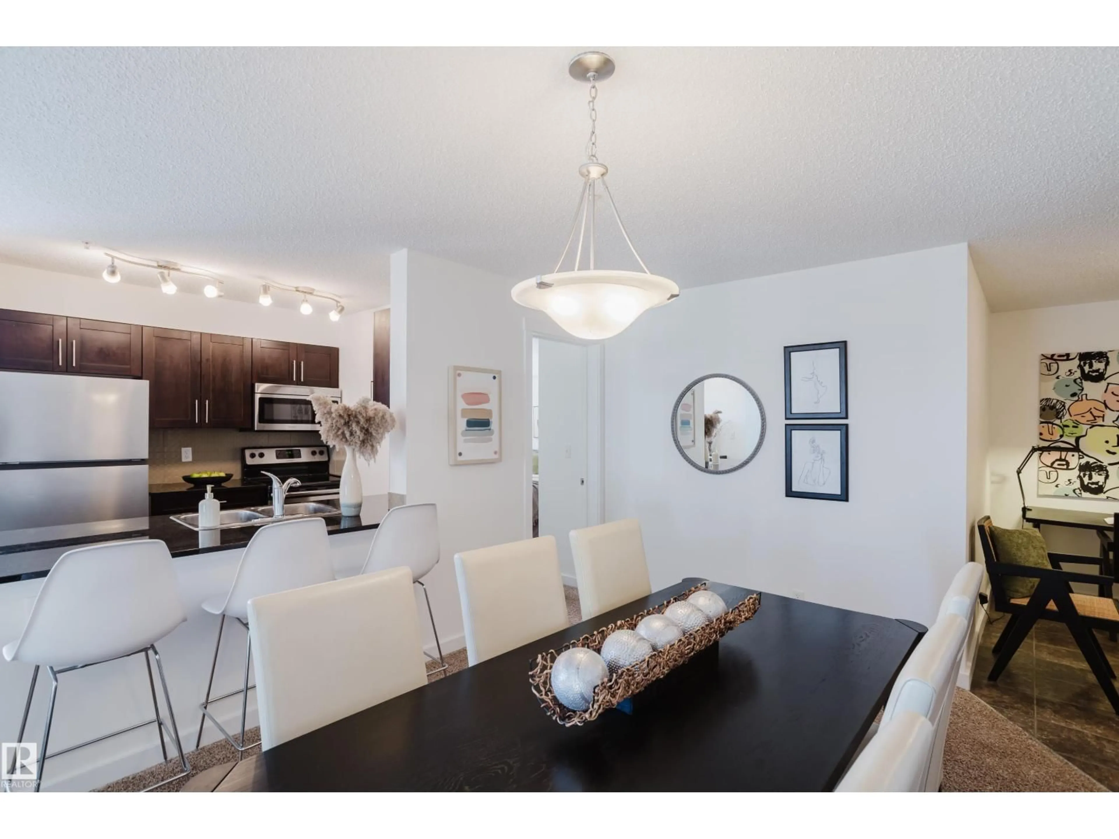 Dining room, wood/laminate floor for 319 - 5804 MULLEN PL, Edmonton Alberta T6R0W3