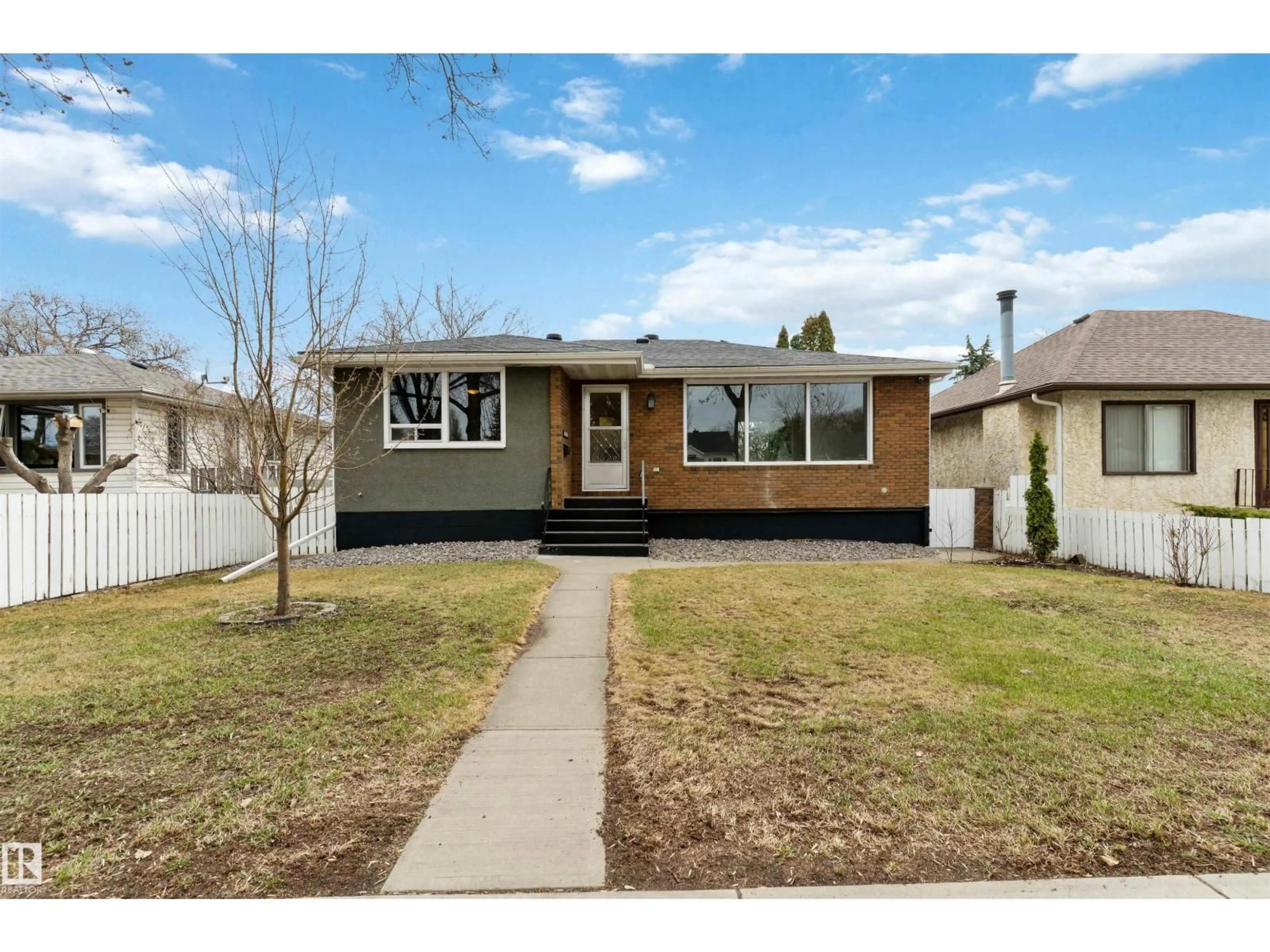 Home with vinyl exterior material, street for 12411 90 ST, Edmonton Alberta T5B3Z9
