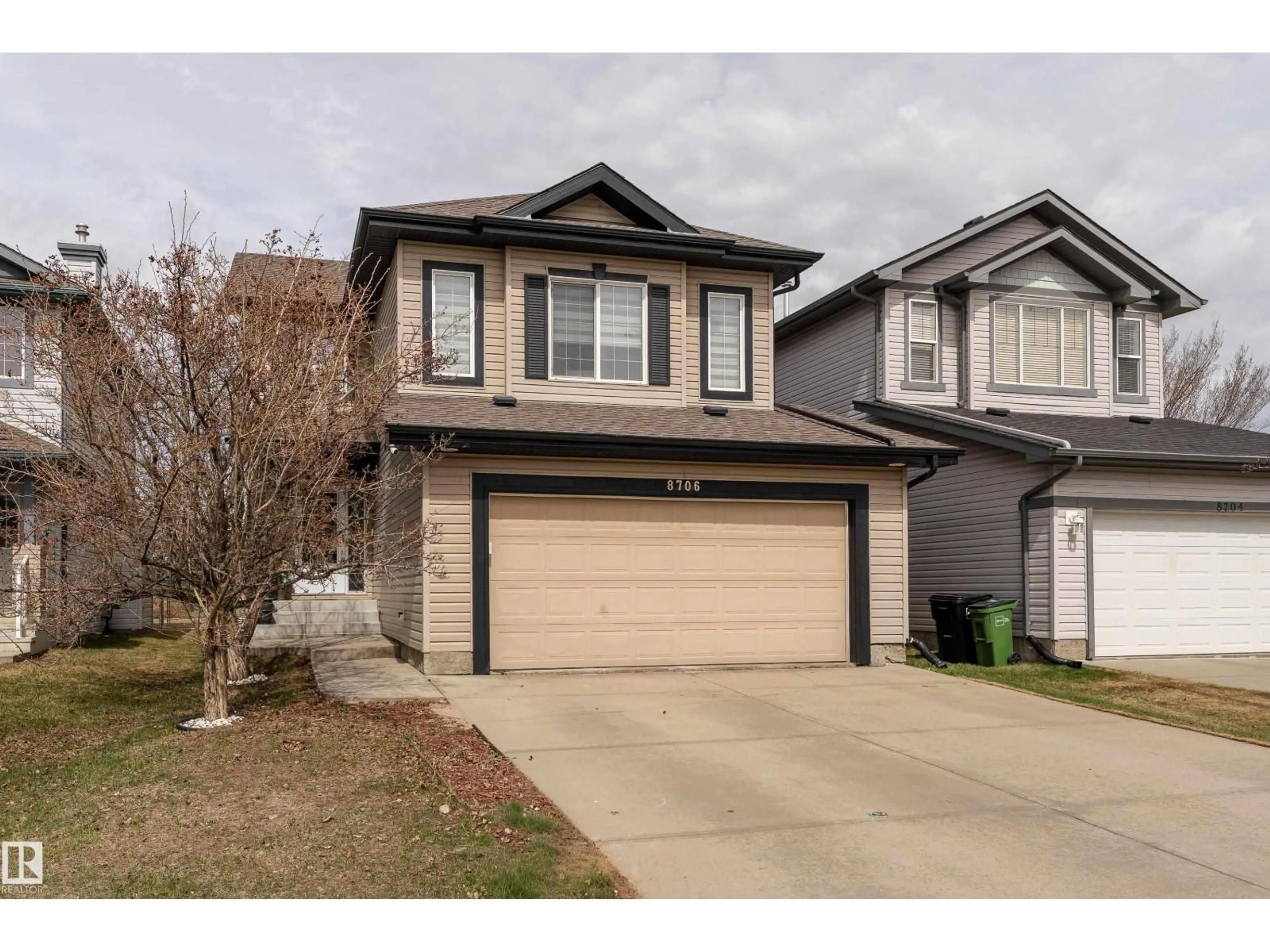 Home with vinyl exterior material, street for 8706 175 AV, Edmonton Alberta T5Z3Z3