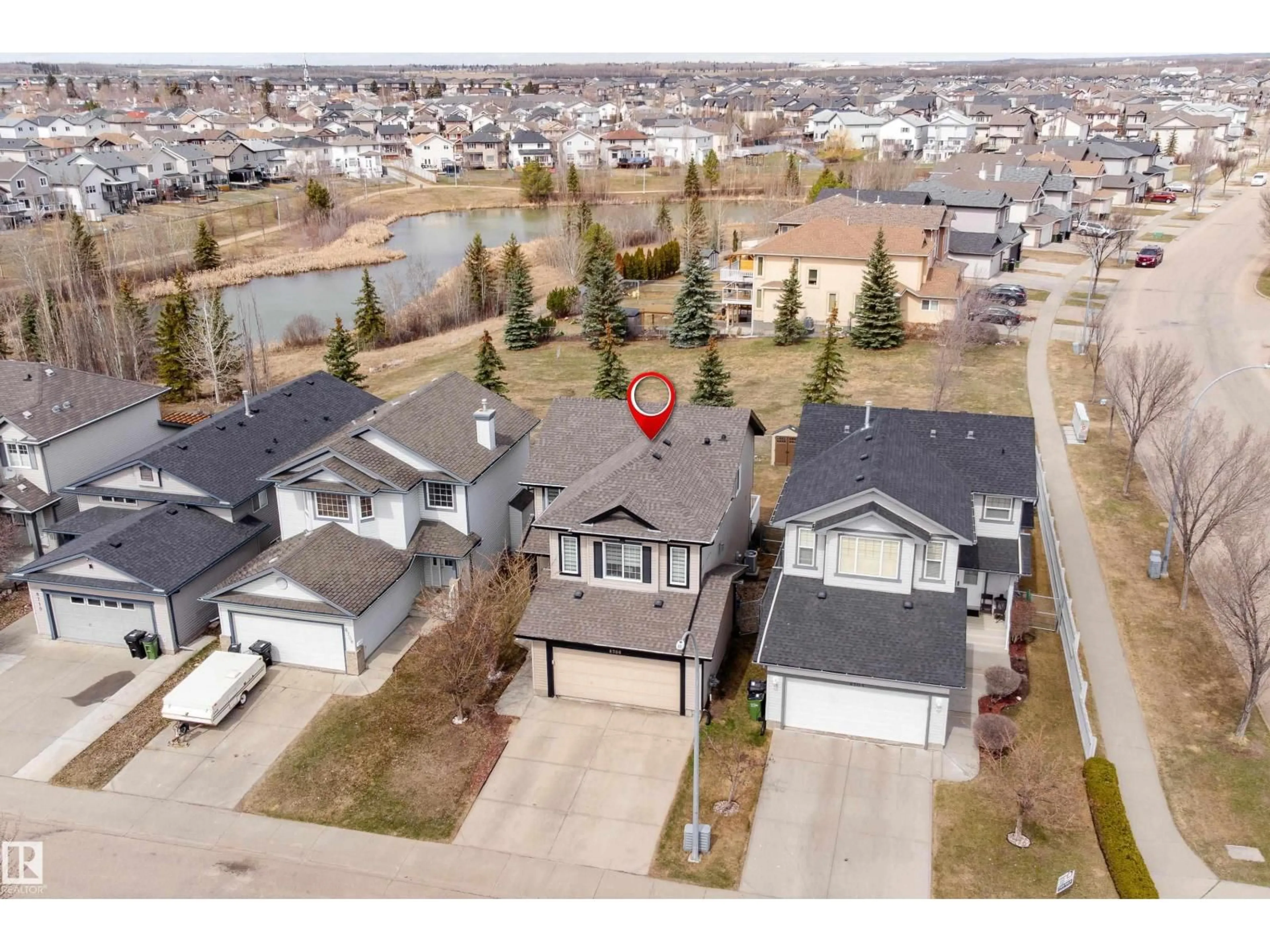 A pic from outside/outdoor area/front of a property/back of a property/a pic from drone, street for 8706 175 AV, Edmonton Alberta T5Z3Z3