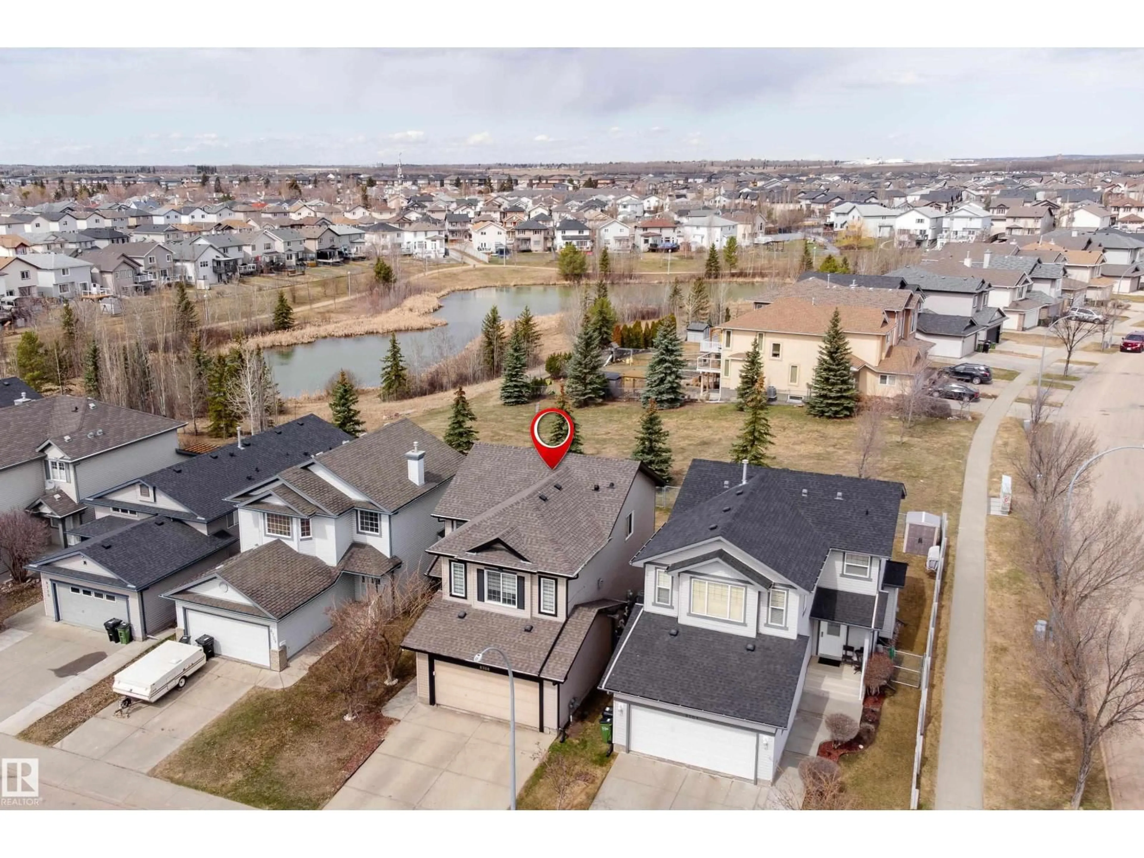 A pic from outside/outdoor area/front of a property/back of a property/a pic from drone, unknown for 8706 175 AV, Edmonton Alberta T5Z3Z3