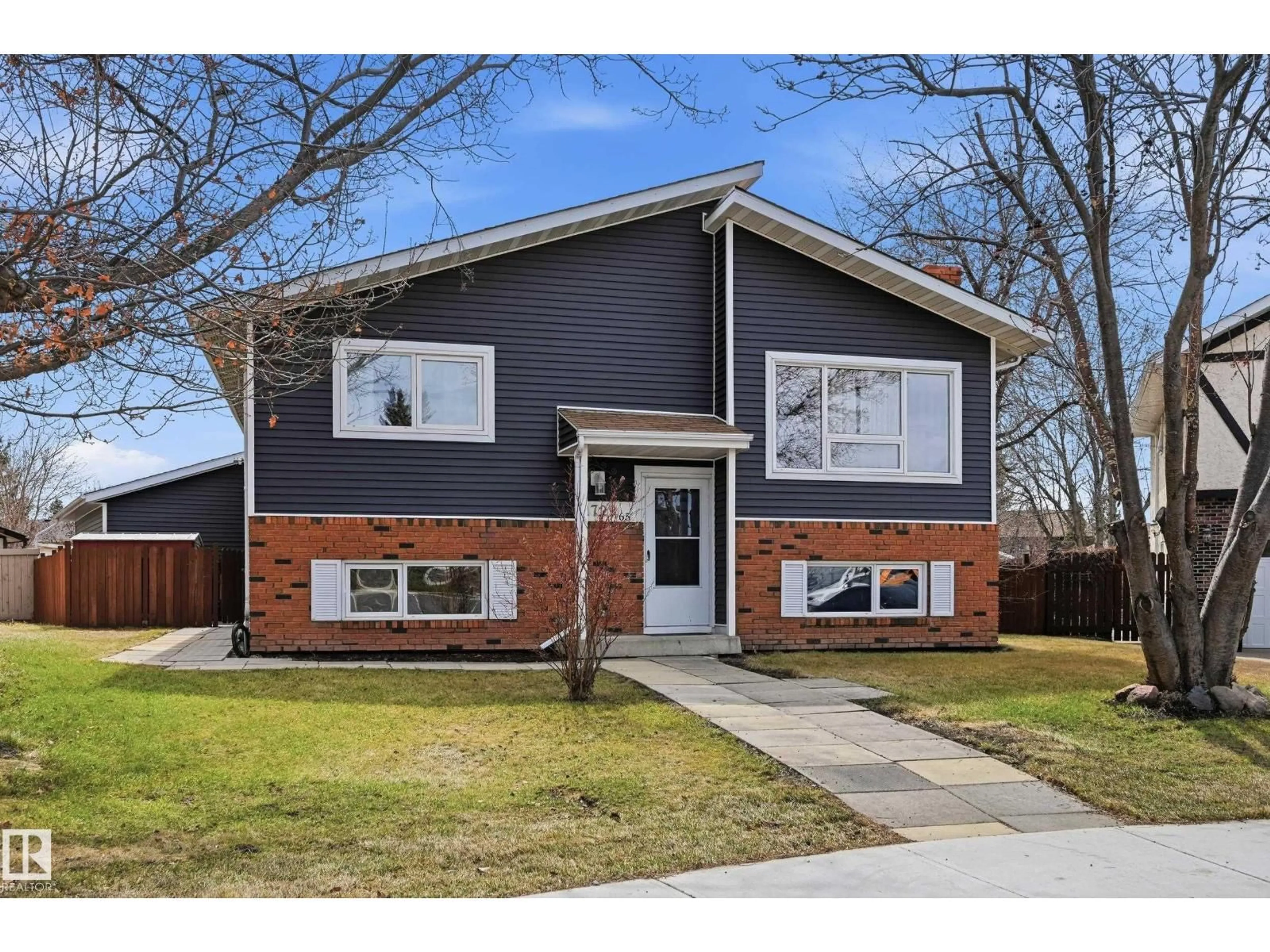 Home with brick exterior material, street for NW - 1729 65 ST, Edmonton Alberta T6L1N1