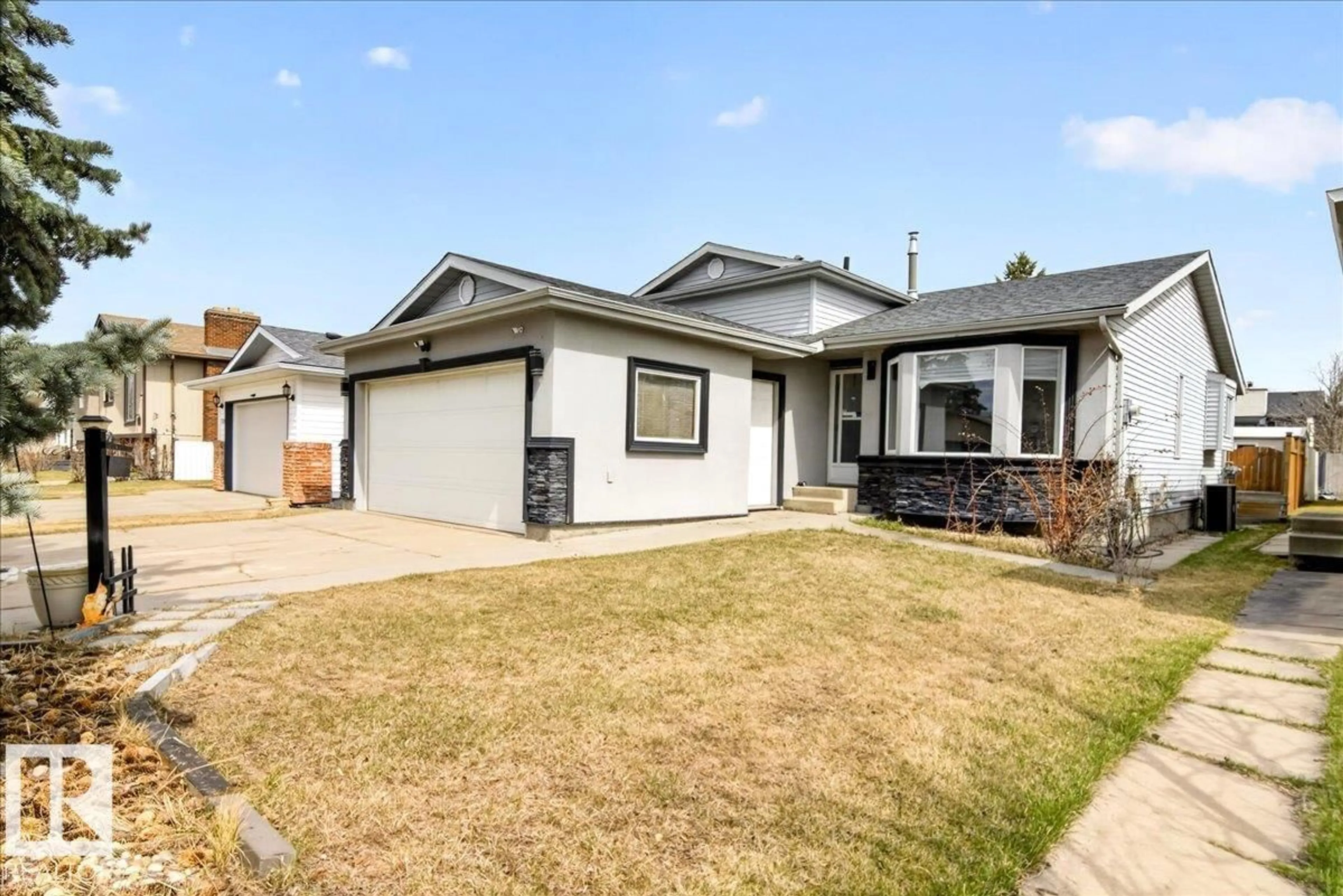 Home with vinyl exterior material, street for NW - 7307 190 ST, Edmonton Alberta T5T5G9