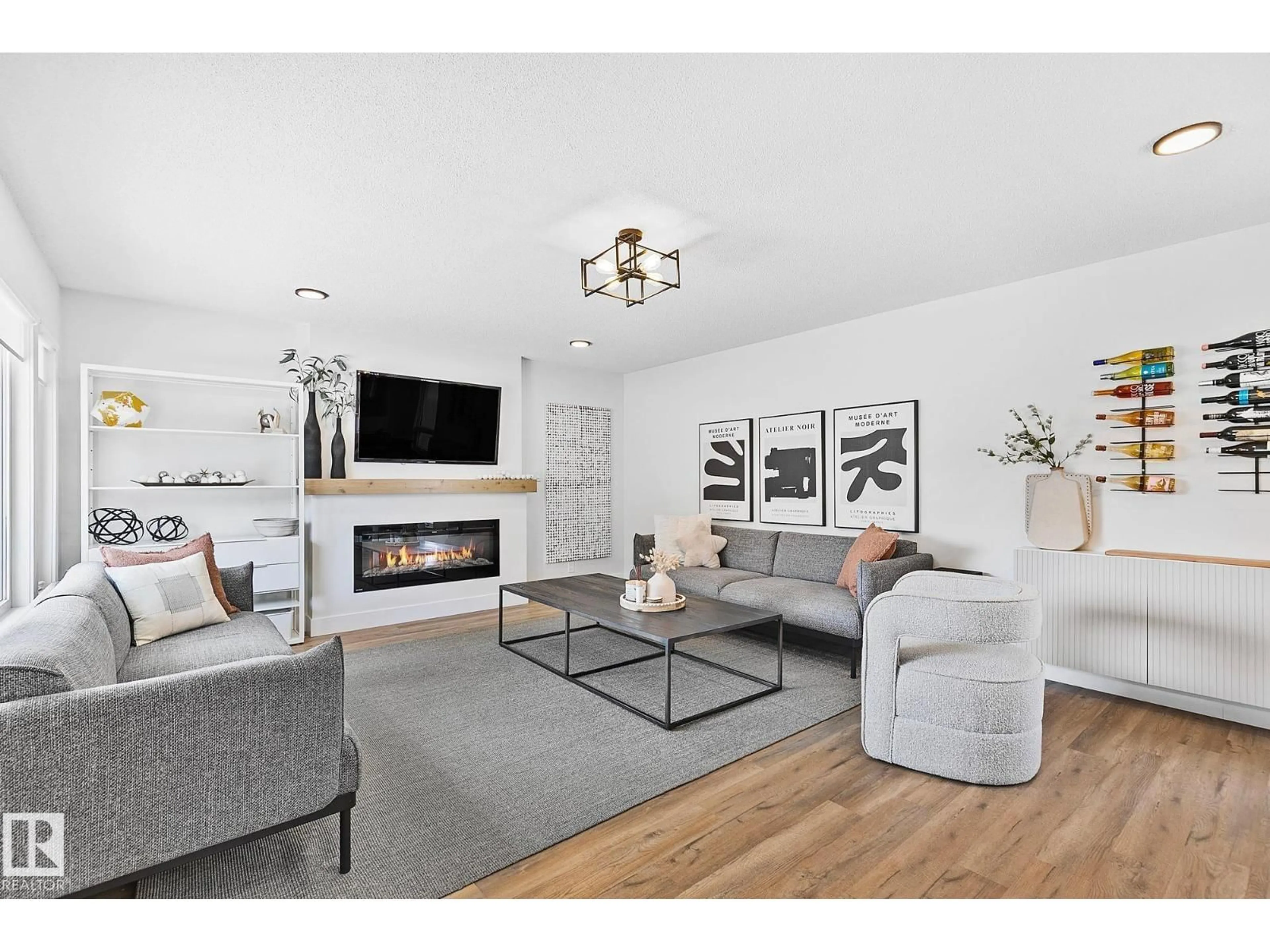 Living room with furniture, wood/laminate floor for 15011 77 AV, Edmonton Alberta T5R3B5
