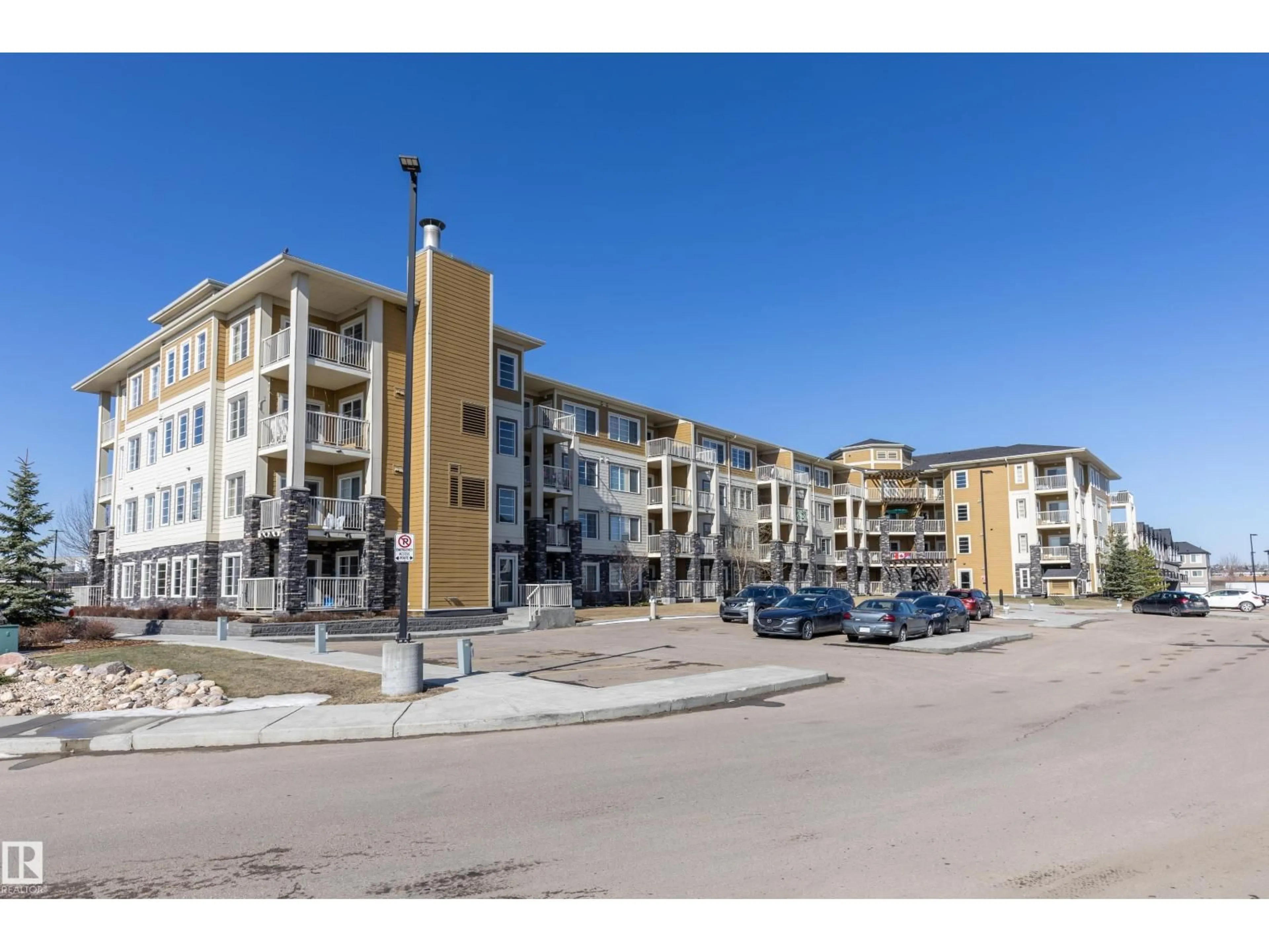 A pic from outside/outdoor area/front of a property/back of a property/a pic from drone, street for 107 - 3670 139 AV NW, Edmonton Alberta T5Y3N5