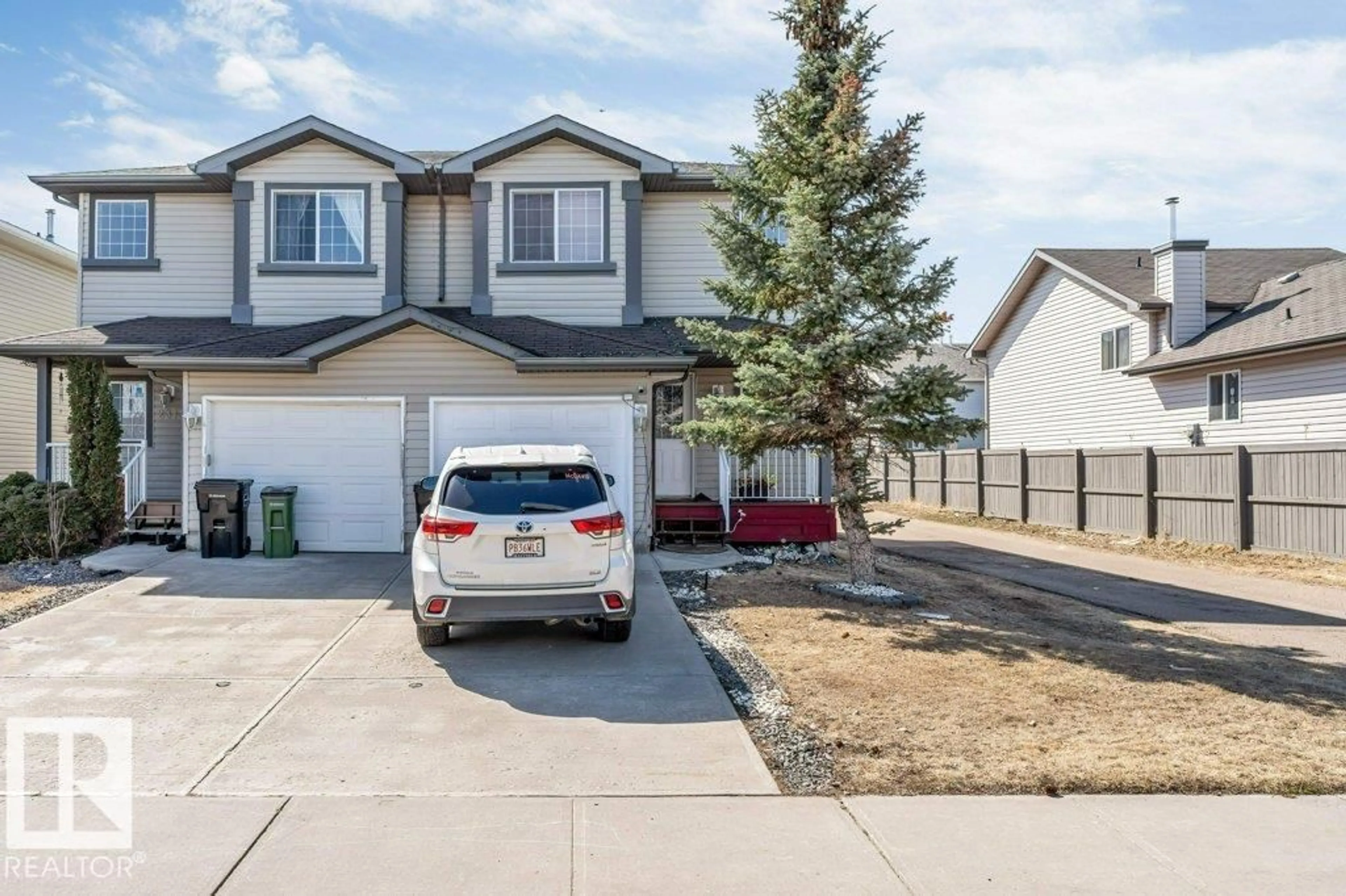 Home with vinyl exterior material, street for 2317 27 AV, Edmonton Alberta T6T0A5