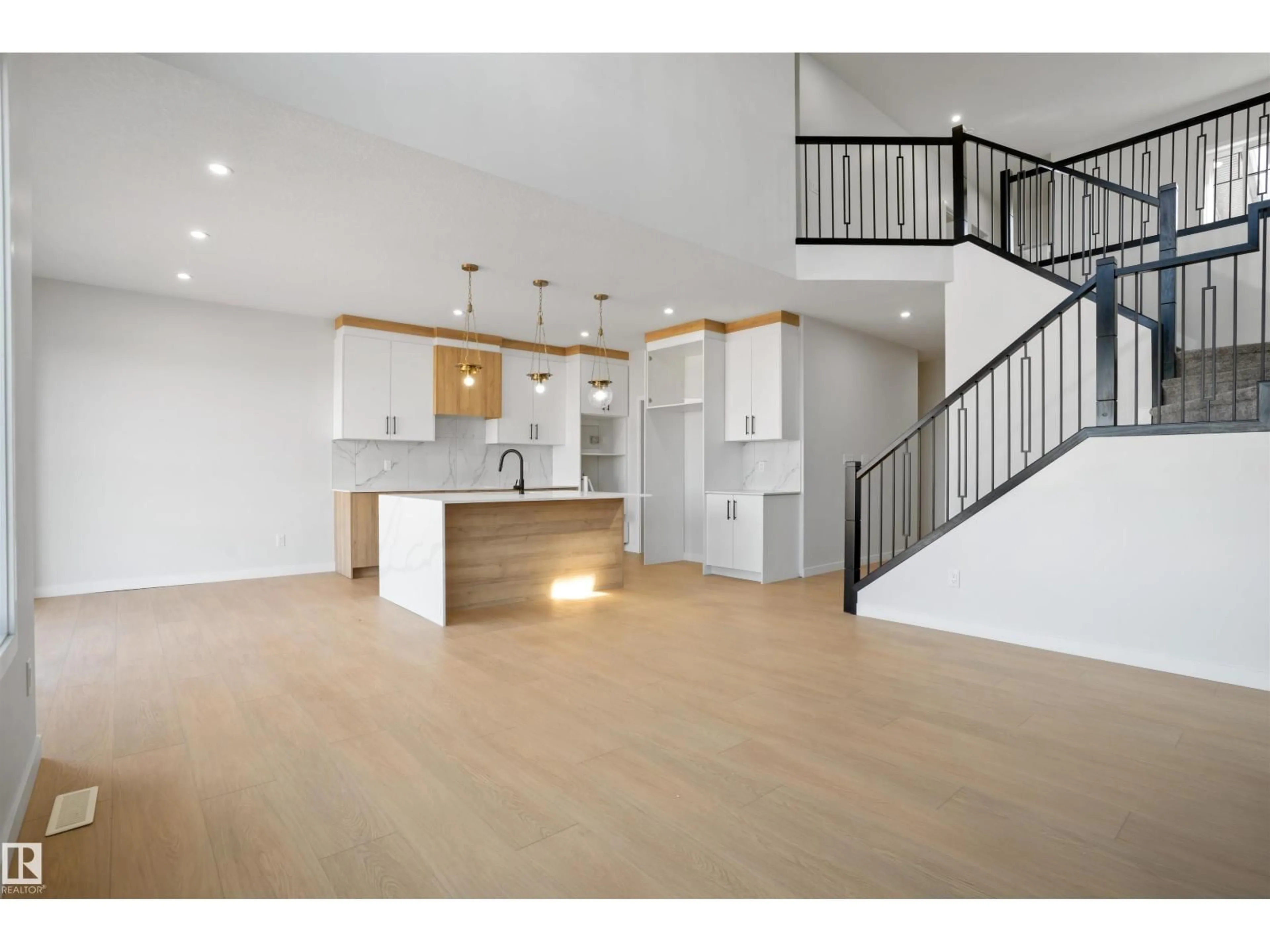 Open concept kitchen, wood/laminate floor for 1849 CROSSBILL LO, Edmonton Alberta T5S0W4