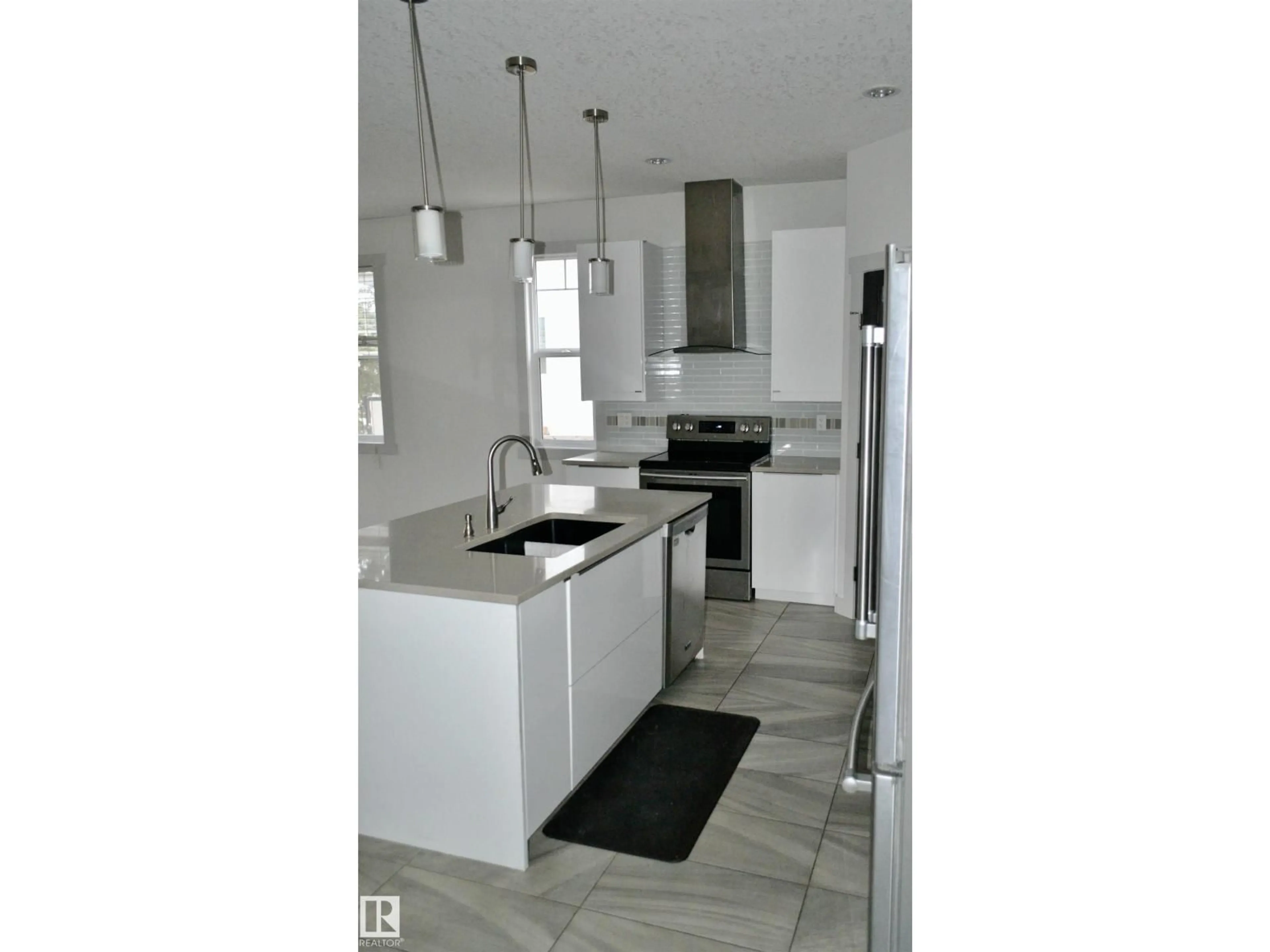 Open concept kitchen, ceramic/tile floor for 8950 81 AV, Edmonton Alberta T6C0W8