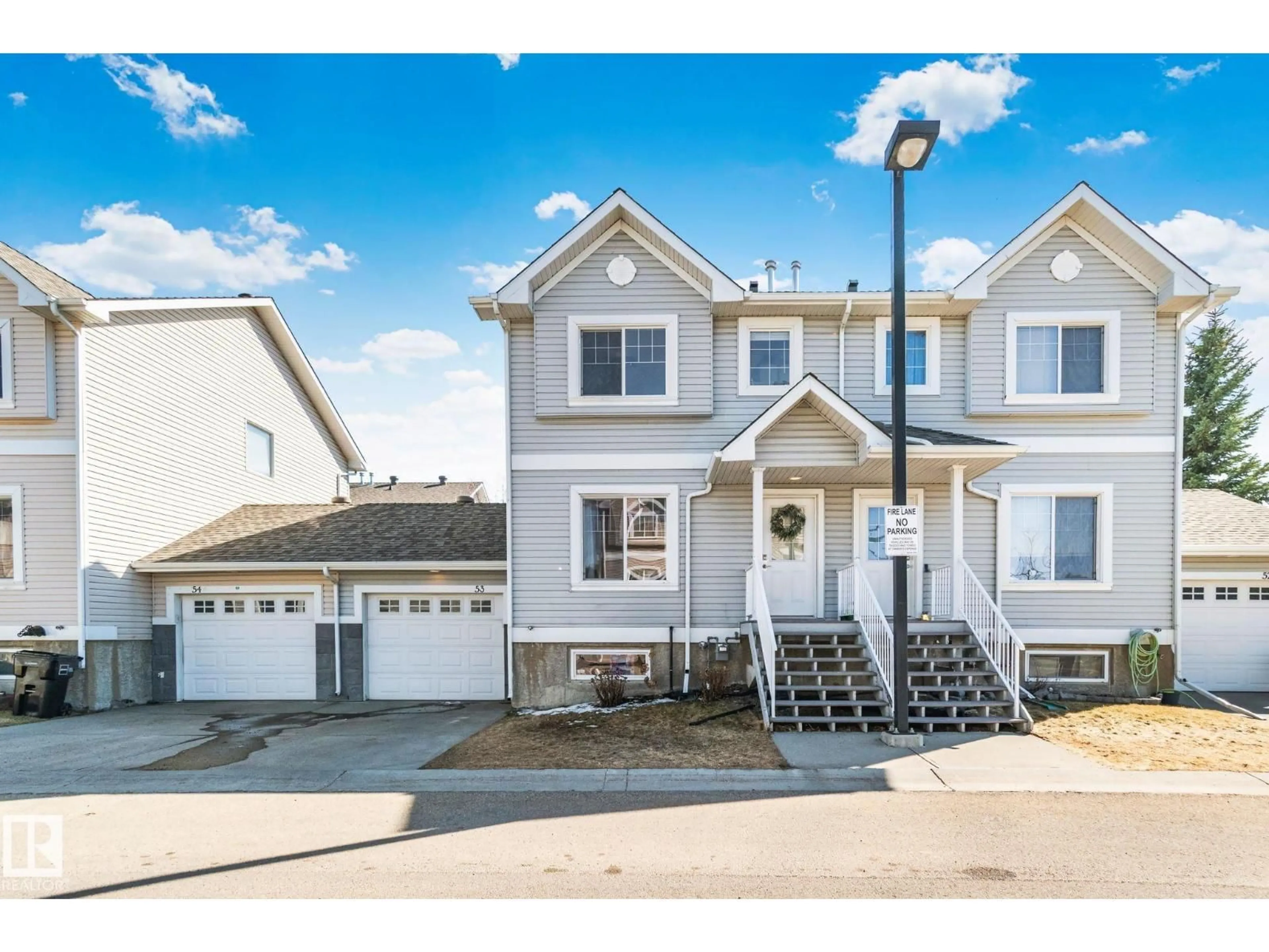 Home with vinyl exterior material, street for 2503 - 53 24 ST, Edmonton Alberta T6T0B5