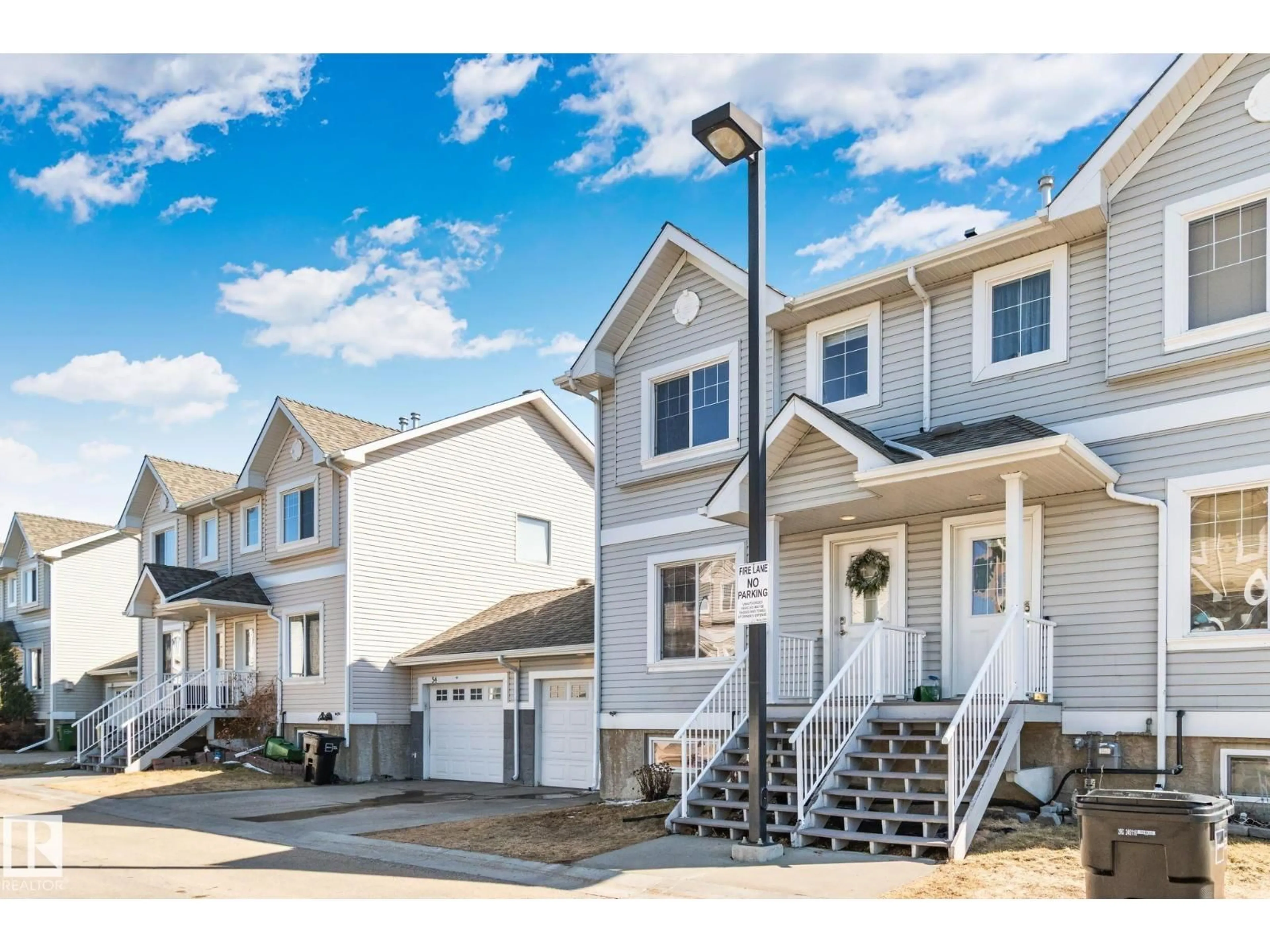 Home with vinyl exterior material, street for 2503 - 53 24 ST, Edmonton Alberta T6T0B5