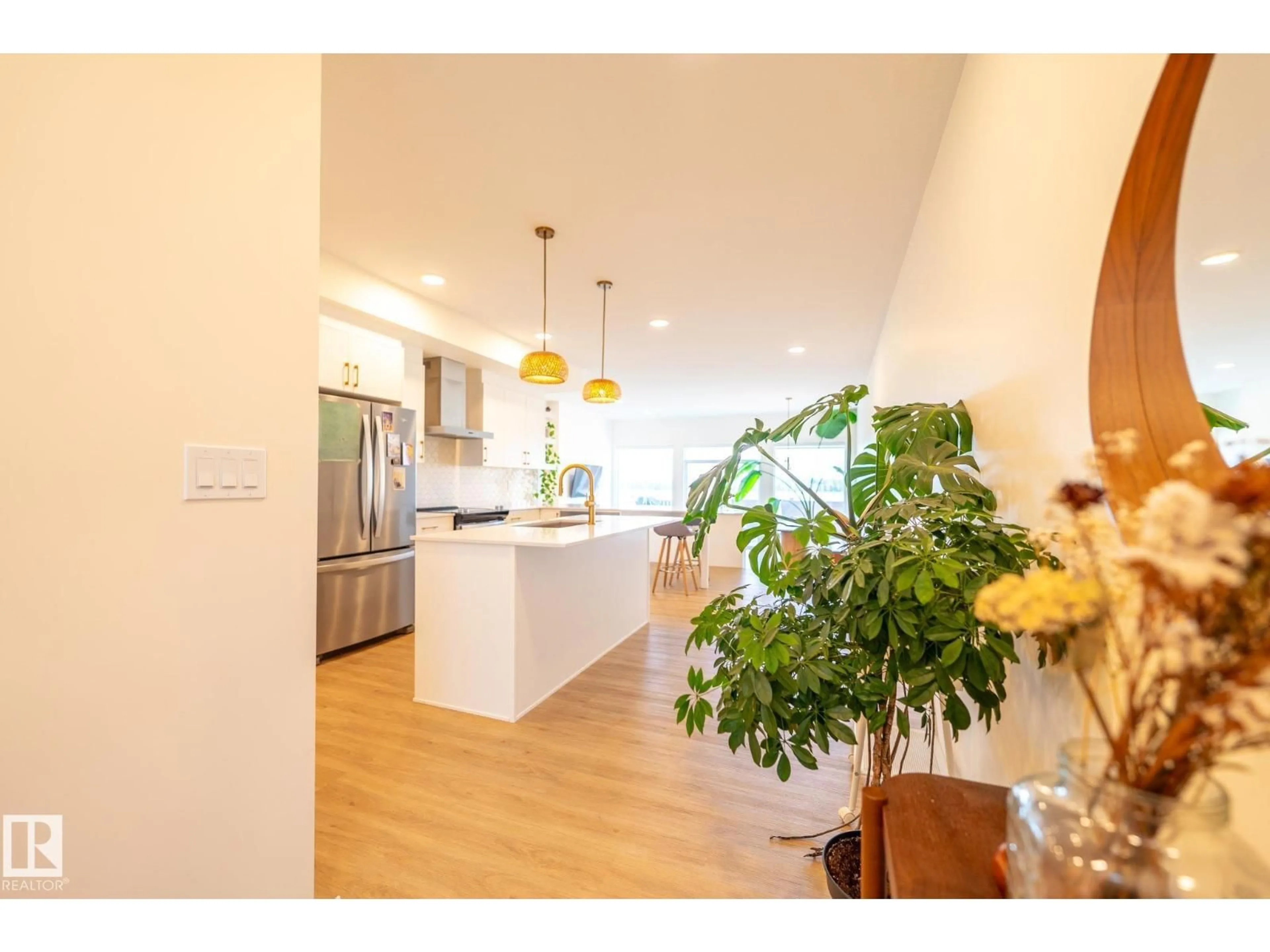 Open concept kitchen, wood/laminate floor for 3315 KULAY WY, Edmonton Alberta T6W5E7