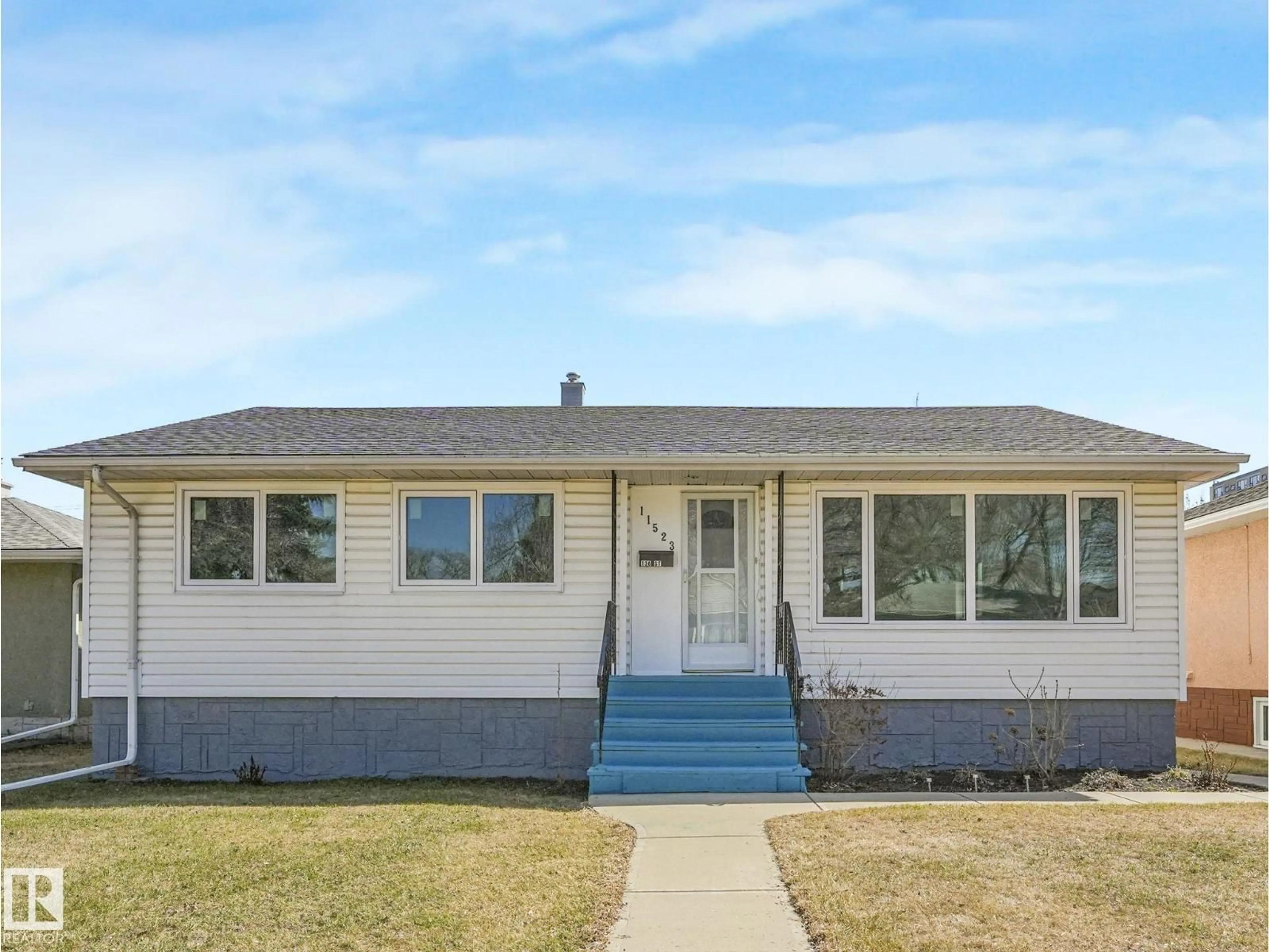 Home with vinyl exterior material, street for 11523 136 ST, Edmonton Alberta T5M1M4