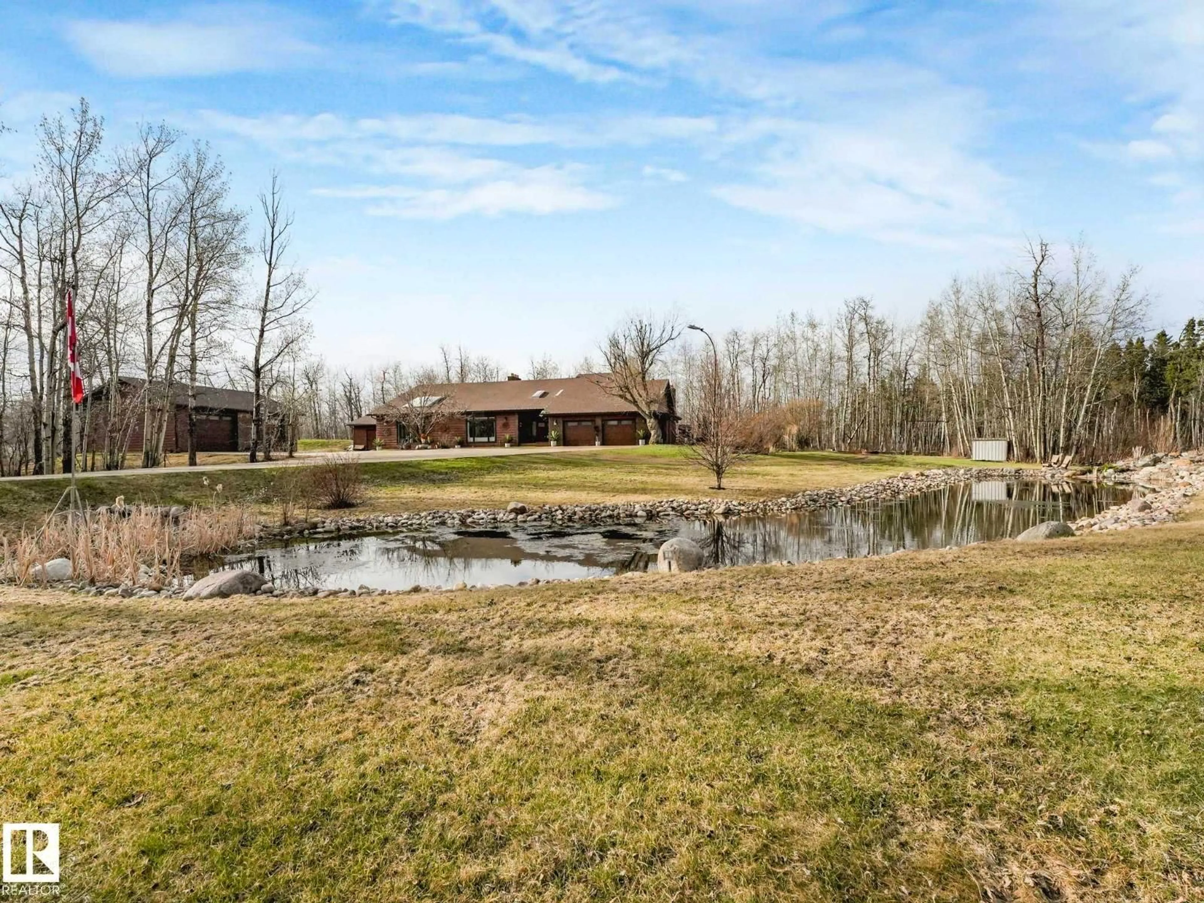 A pic from outside/outdoor area/front of a property/back of a property/a pic from drone, water/lake/river/ocean view for 51313 - 182 RGE ROAD 231, Rural Strathcona County Alberta T8B1K7