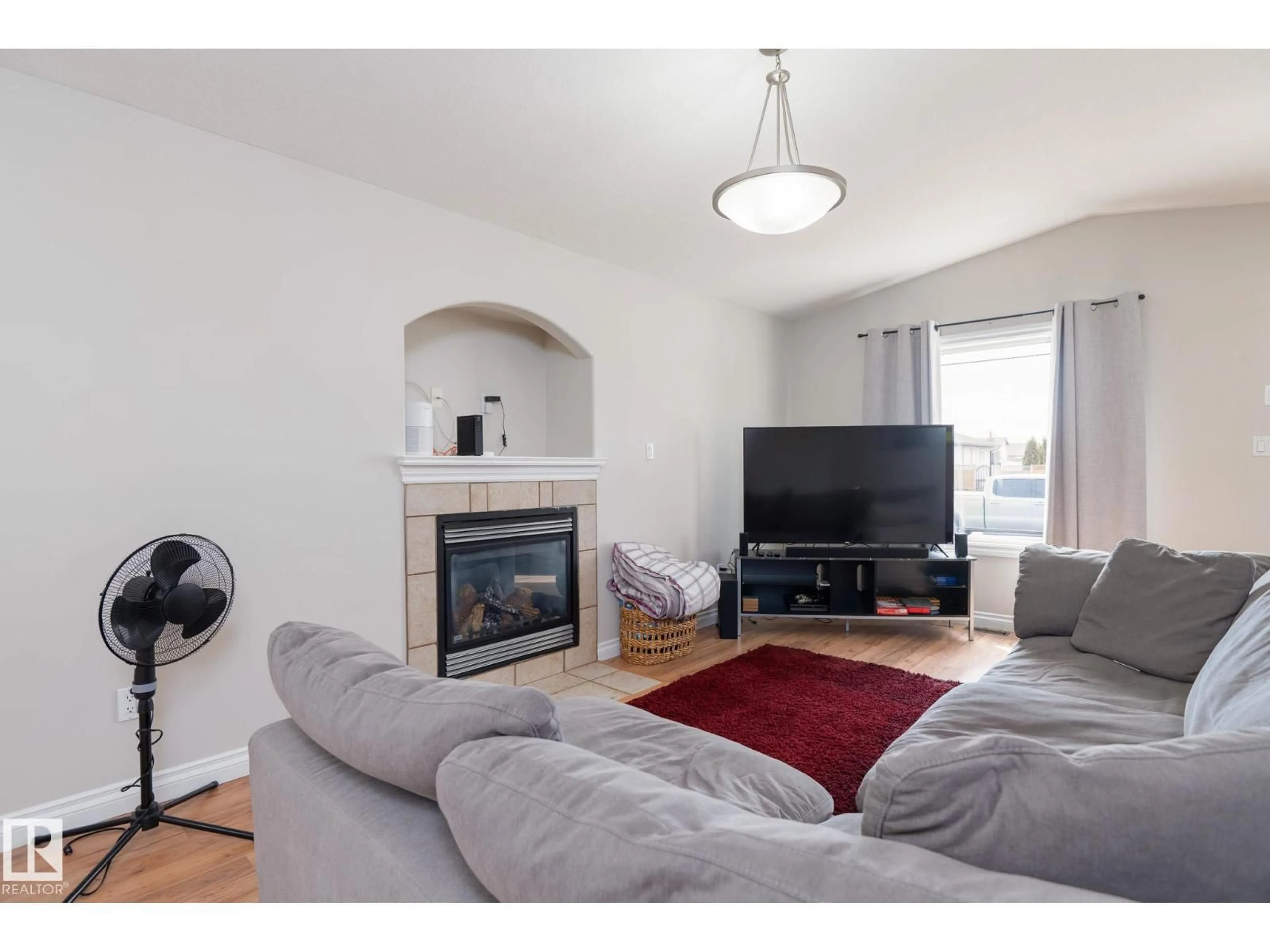 Living room with furniture, wood/laminate floor for 2620 LAKE AV, Cold Lake Alberta T9M0A1