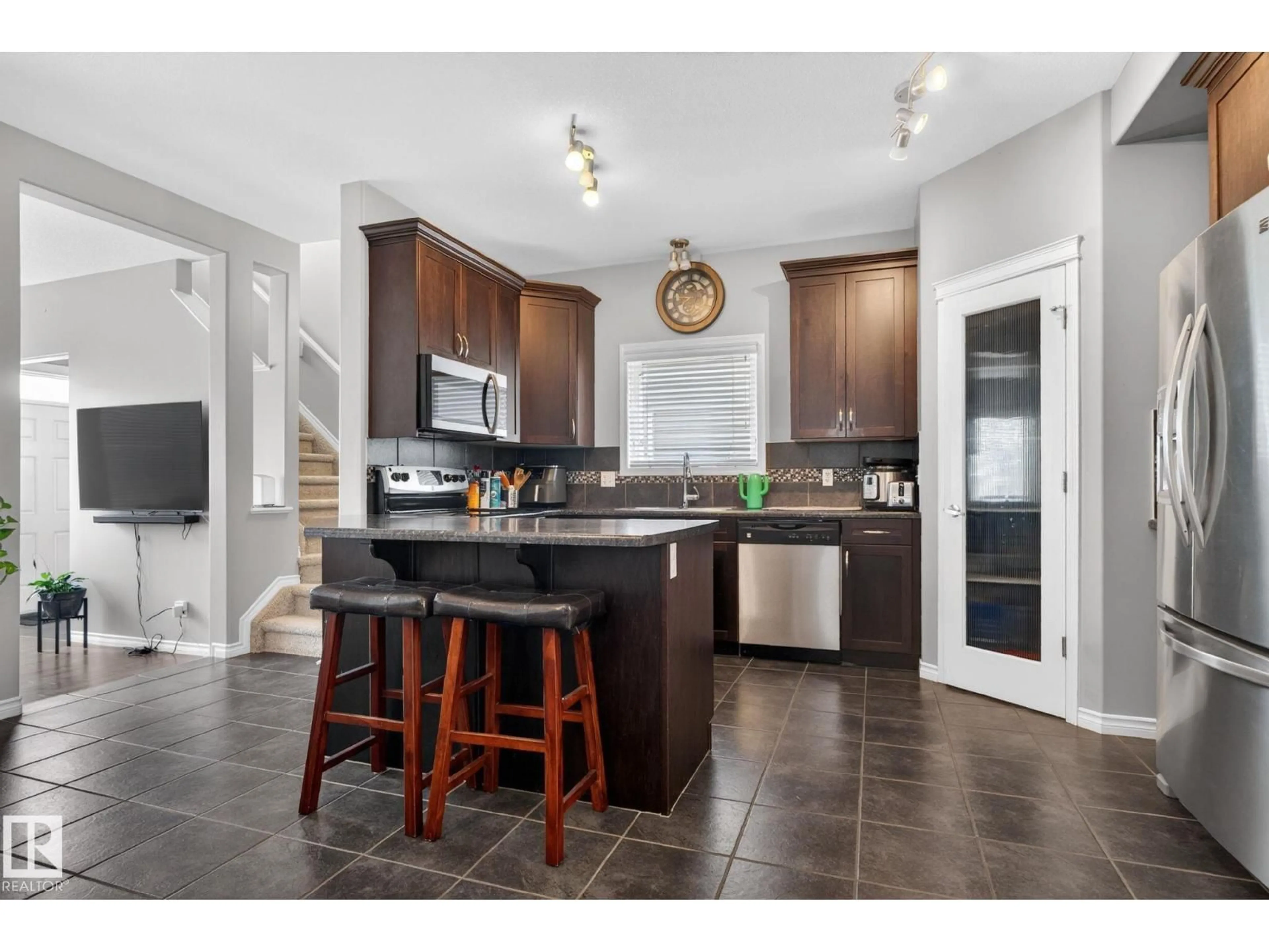 Open concept kitchen, ceramic/tile floor for 6912 22 AV, Edmonton Alberta T6X0V4