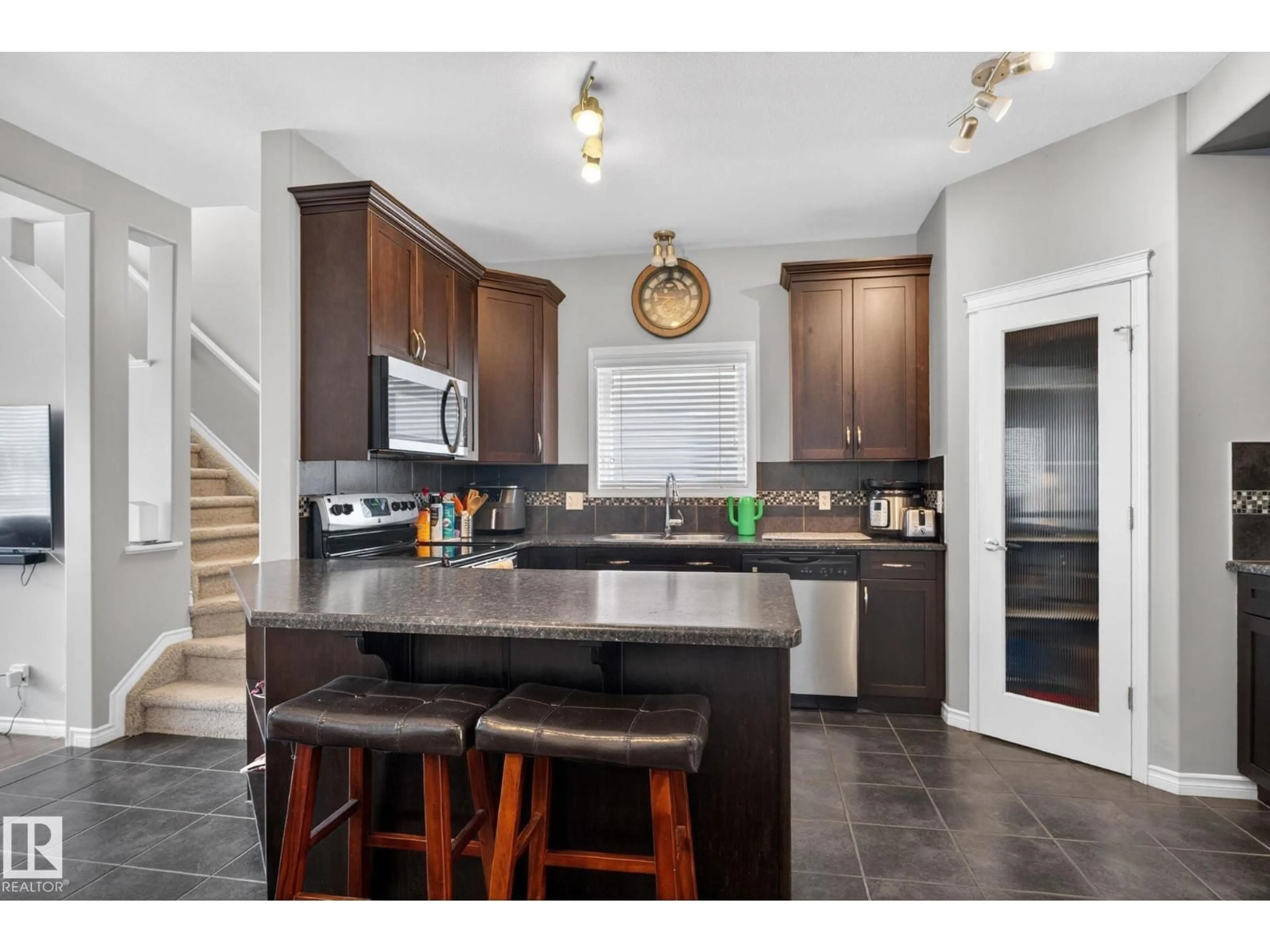 Open concept kitchen, ceramic/tile floor for 6912 22 AV, Edmonton Alberta T6X0V4