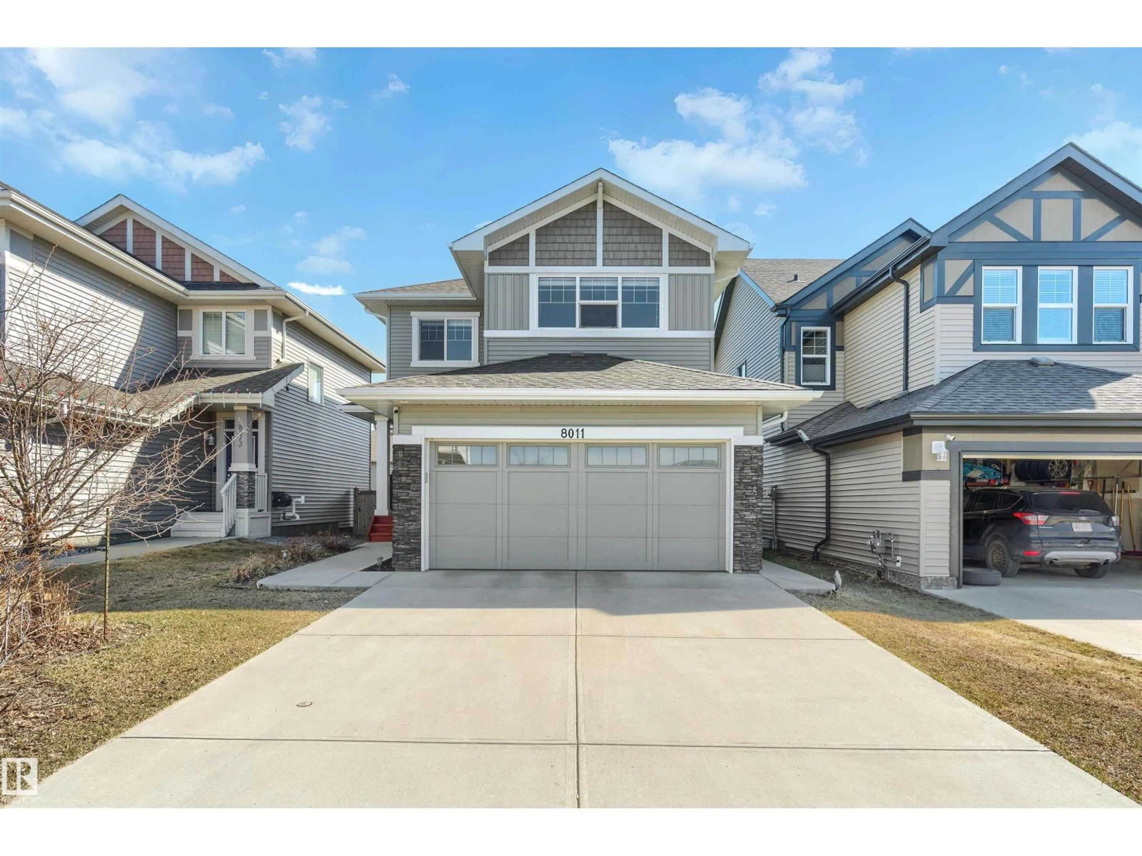 Home with vinyl exterior material, street for 8011 EVANS CR, Edmonton Alberta T6M0T7