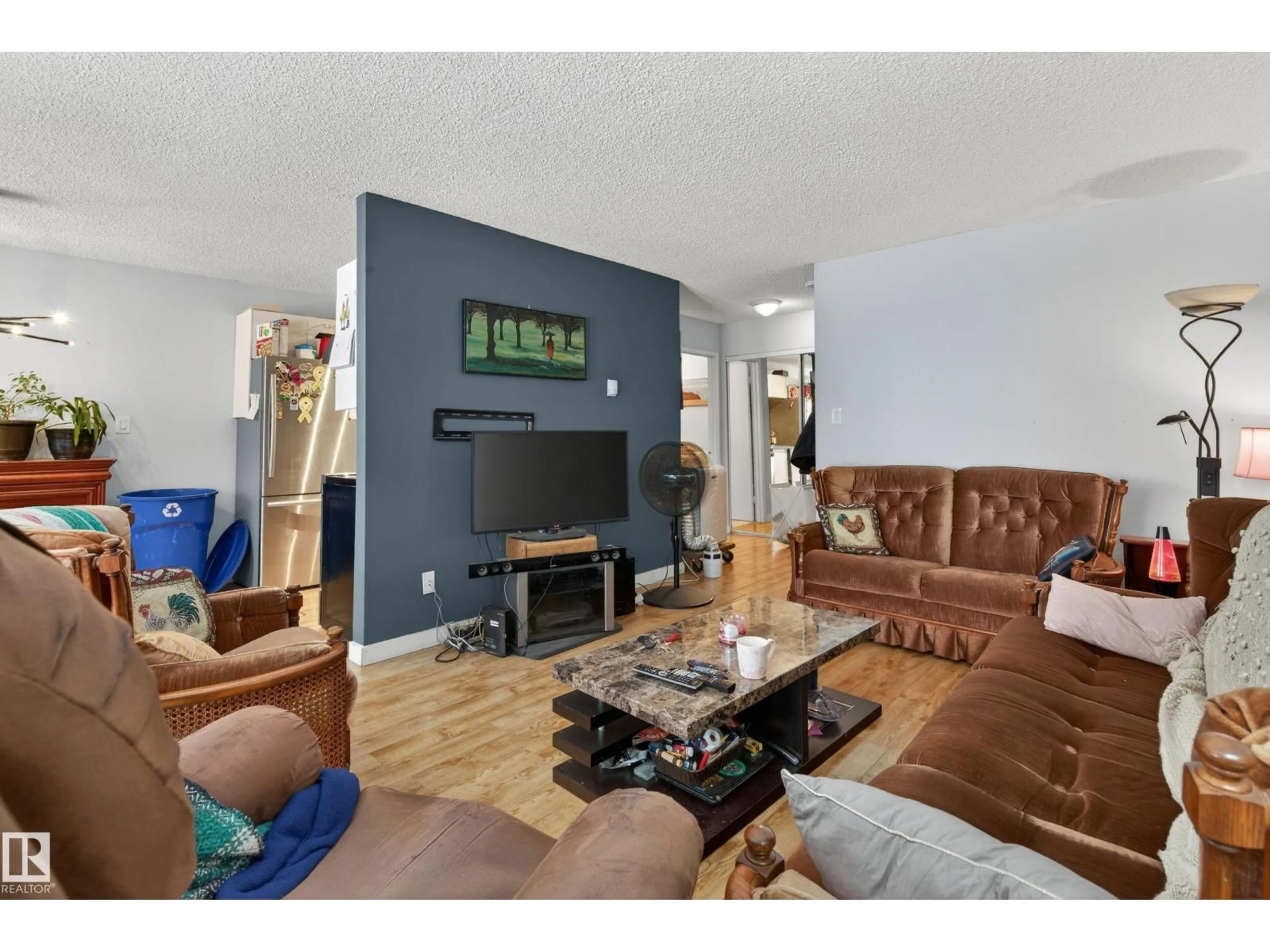 Living room with furniture, wood/laminate floor for 13454 FORT RD NW, Edmonton Alberta T5A1C5