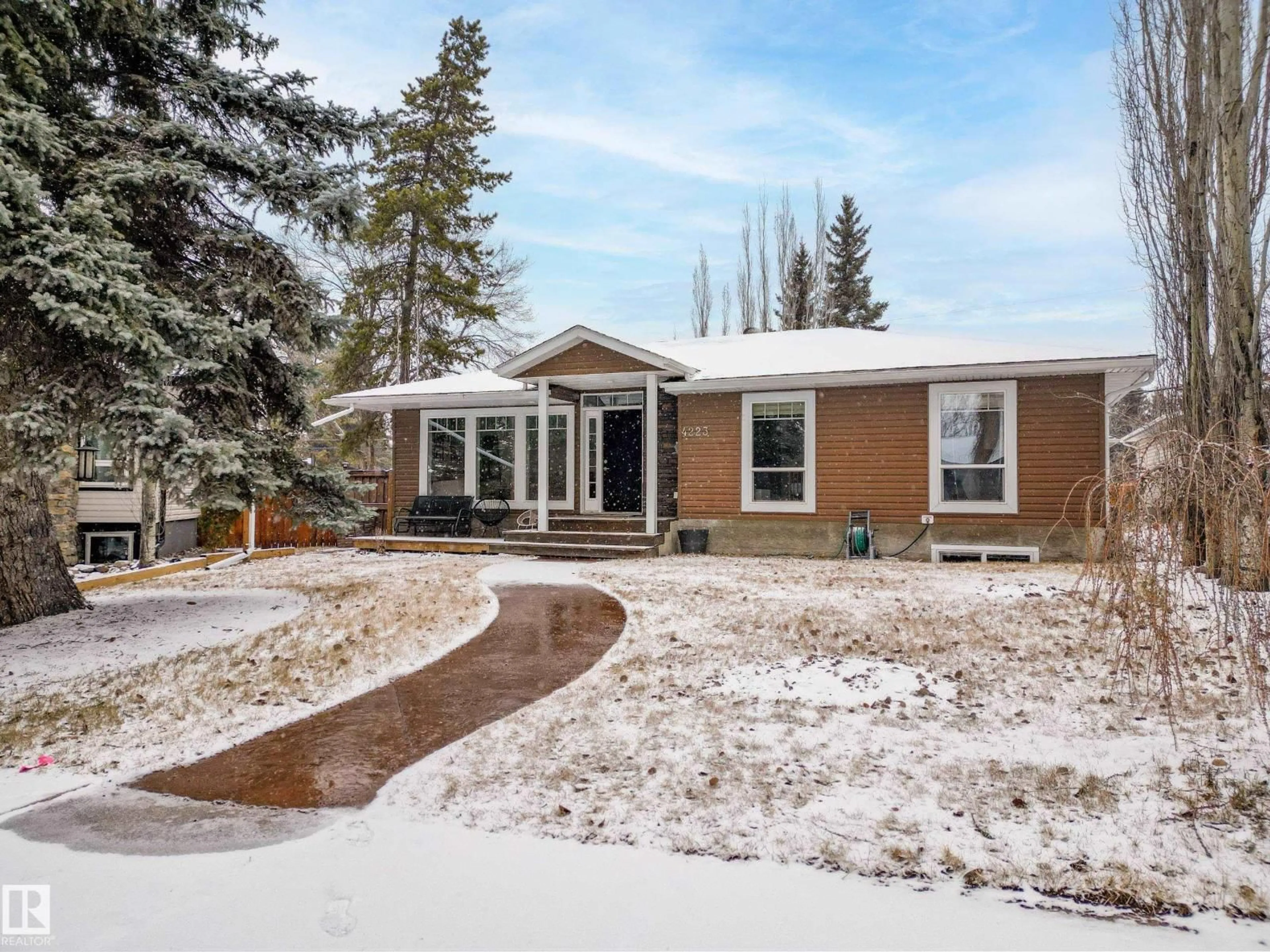 Home with vinyl exterior material, street for NW - 4223 120 ST, Edmonton Alberta T6J1X9