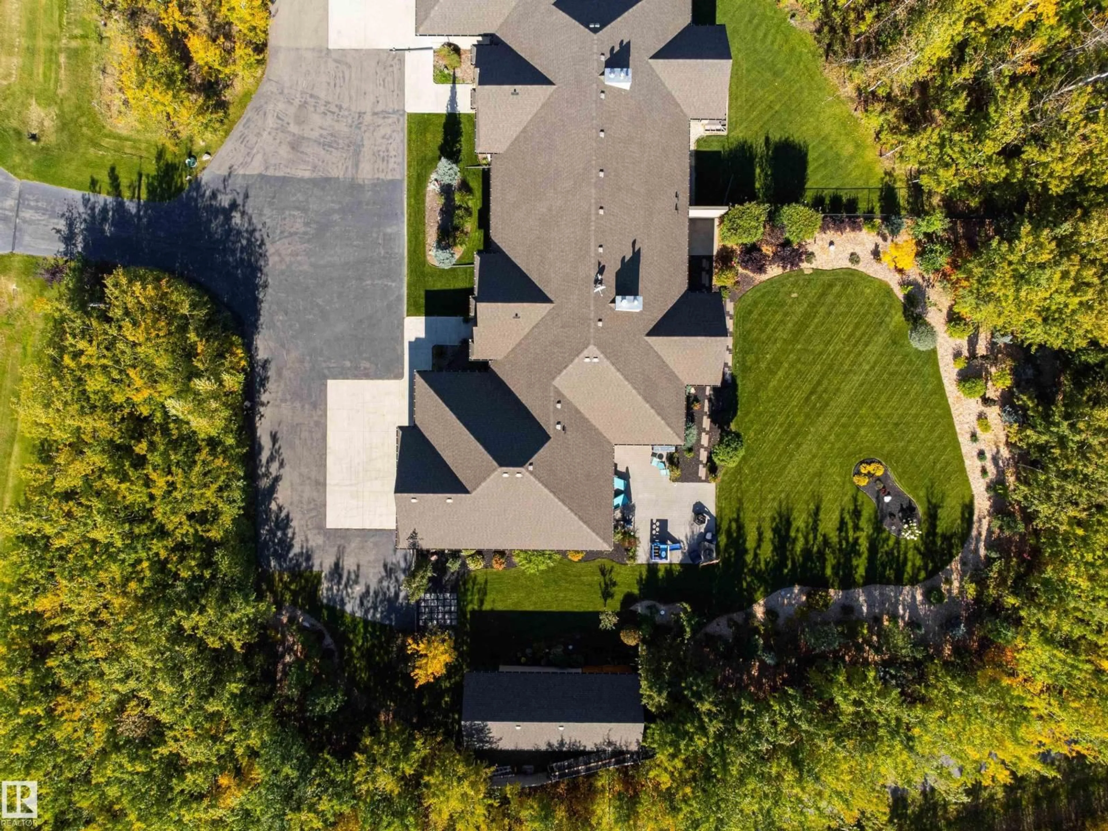 A pic from outside/outdoor area/front of a property/back of a property/a pic from drone, street for 21A - 21A RGE RD 272 RGE RD, Rural Parkland County Alberta T7X3M5