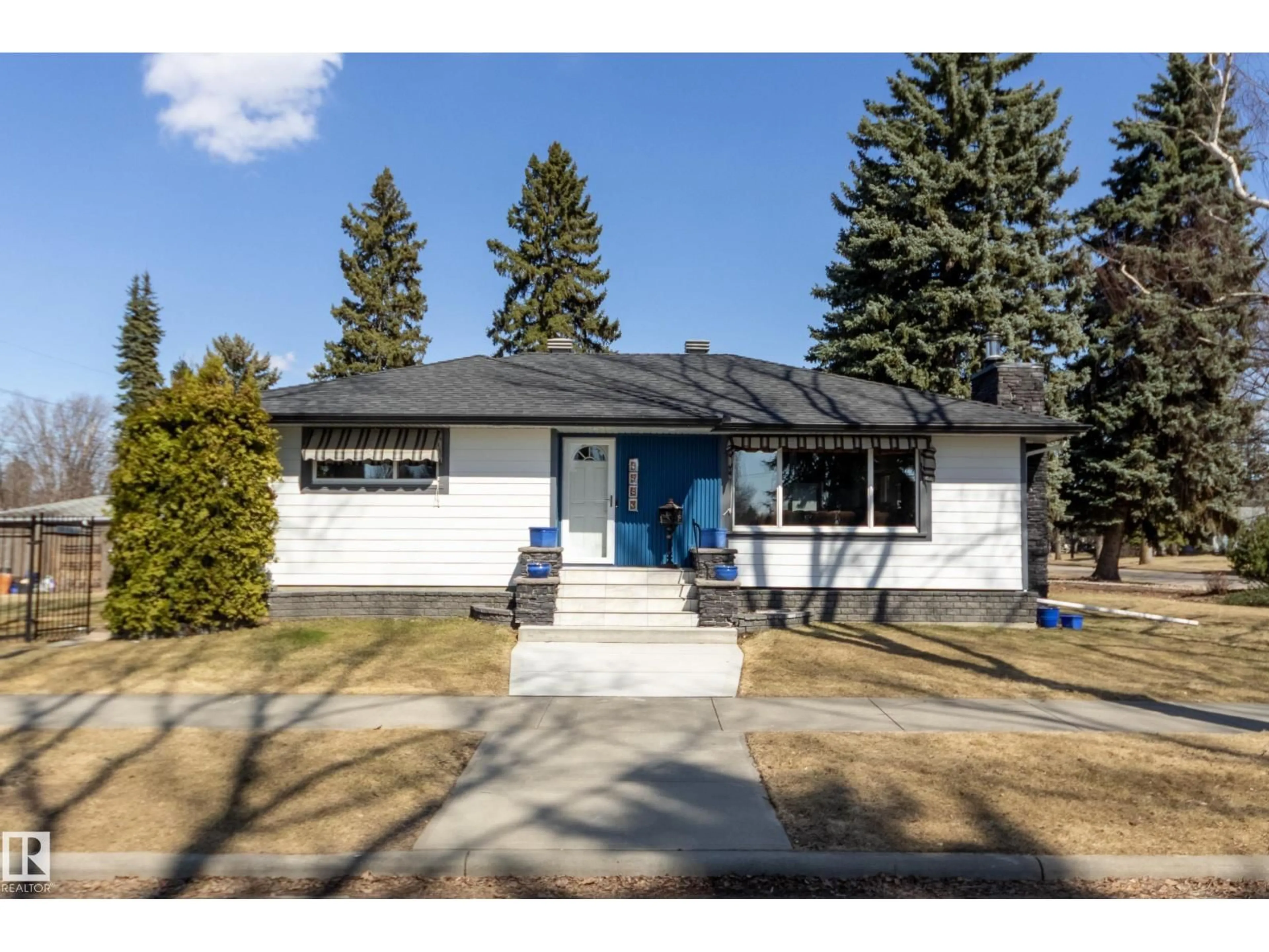 Home with vinyl exterior material, street for 9503 77 ST, Edmonton Alberta T6C2M8