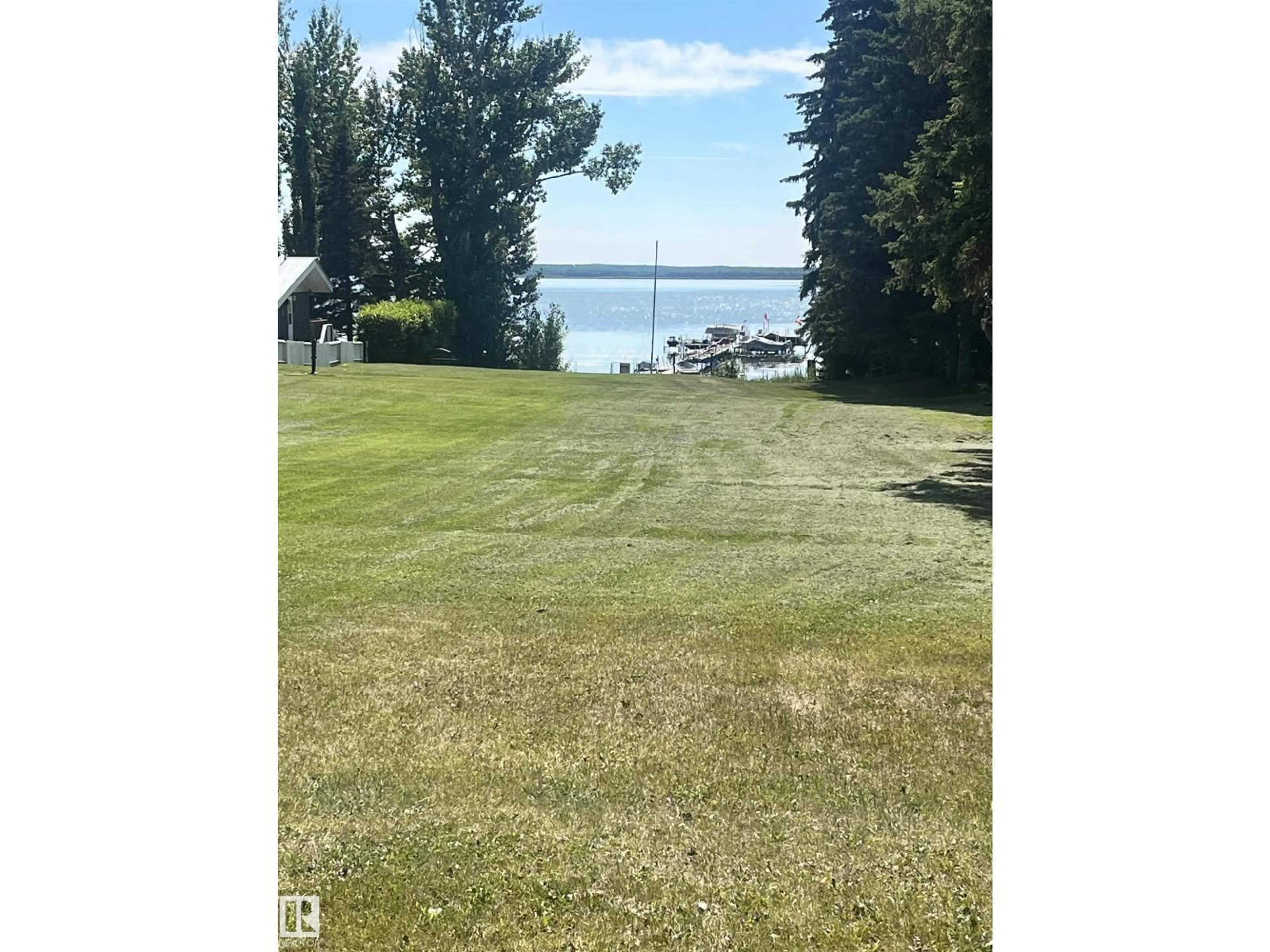 A pic from outside/outdoor area/front of a property/back of a property/a pic from drone, water/lake/river/ocean view for 408 4 STREET, Rural Lac Ste. Anne County Alberta T0E1A0